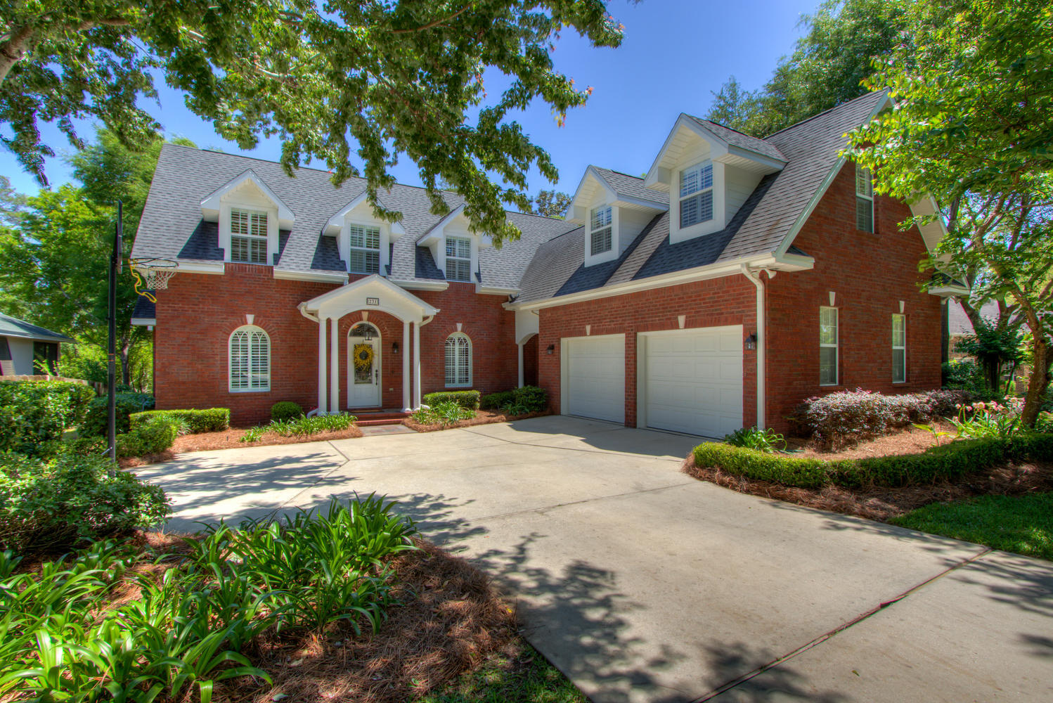 **3D Virtual Tour Available** This Swift Creek home sits on an extremely large and private 1+ acre lot that backs up to a wooded area and Jason's trail. This custom built 4 bedroom home has a very versatile floor plan. Downstairs you are invited into the open foyer overlooking the living room with vaulted ceilings and windows that capture the view of the serene yard space through the incredible screened porch. The plantation shutters, wood floors and fireplace are impressive. The kitchen area is the heart of the home with a second fireplace in the open keeping room, built-in china cabinet, wine fridge, desk area, and plenty of room to entertain. The master is located on the main level while all other bedrooms are upstairs.