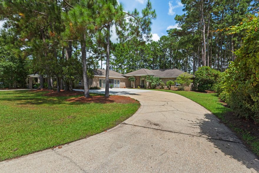 LIMITLESS potential with this spacious home, boasting 3 separate living quarters! Large 3 bedroom, 2 bath main house, with expansive lake views from the very open living and dining areas as well as the kitchen. There are two additional separate guest houses complete with kitchen and full bathrooms. Use them for overflow guests, elderly parents or kids that need a little space. Let's talk about this lot...it's HUGE!! Sit on the dock and fish or just take in the serene setting. This home offers loads of privacy, but centrally located in Santa Rosa Beach, in close proximity to the restaurants, schools, shopping and more. The all brick exterior is built to last and low maintenance as well. Awesome family-friendly neighborhood with no HOA! This one won't last long! Call today to see this gem!