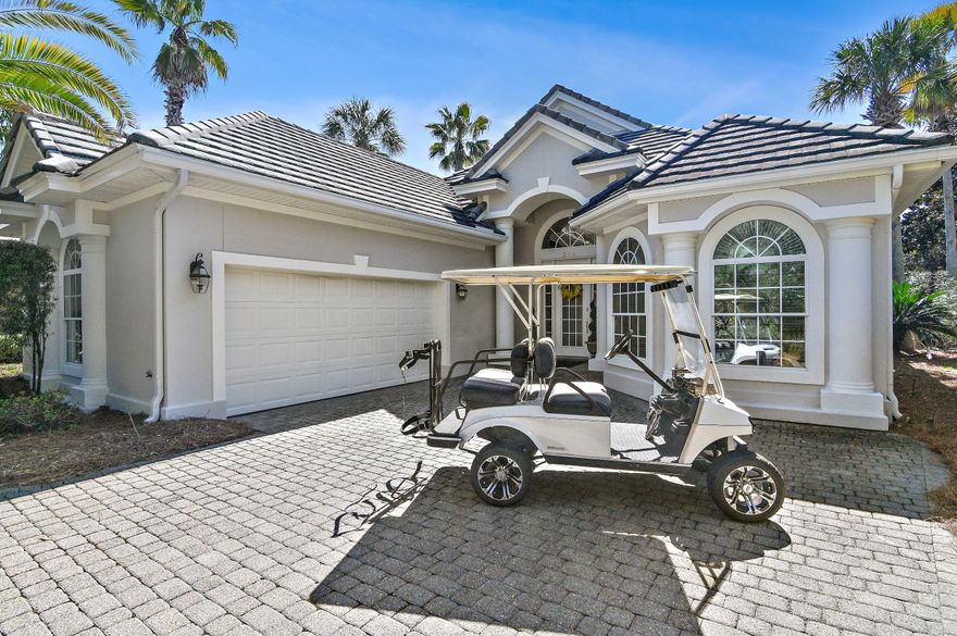 NEW ROOF - FULLY FURNISHED INCLUDING GOLF CART! Absolutely spotless 3 bedroom, 3 bath custom lakefront home! This beauty shows like a model! Don' let the age fool you...this home looks brand new....very well-maintained and it shows! Loads of custom features including brick paver driveway, raised ceilings, new LV flooring, crown molding, domed ceiling in the dining room, bull-nosed corners, arched windows, butted joint window in the breakfast room, XIR solar window film (energy efficient, helps block UV rays), kitchen updated in 2018 with solid surface counters, upgraded lighting and cabinetry  New refrigerator and cooktop added in 2022. All 3 bedrooms have private baths with the updated master featuring a soaker tub, two vanities, private water closet, walk-in shower and 2 walk-in closets. Sunny kitchen/casual dining area is open to the great room and is perfect for entertaining. The study is currently being used as a media room. Sliding glass doors open to the pool deck, with covered patio area, salt water pool upgrade in 2023 that included new pool heater (industrial Hayward pump) and new circulator pump with water feature fountain overlooking the lake. Spotless Garage was upgraded in 2023 with Premier One floor coating system. Custom built-in storage keeps the garage organized. There is also an additional storage closet in the garage and attic storage. Home exterior was painted 2023 with elastameric paint & new belt driven garage door 2021(very quiet). New Hot water heater installed 1/24 - HVAC 12/20 Move-in ready! Regatta  Bay is an exclusive gated Golf Course community that is highly known throughout the southeast. This is a must see!! As always, all dimensions and fees should be verified by buyer.