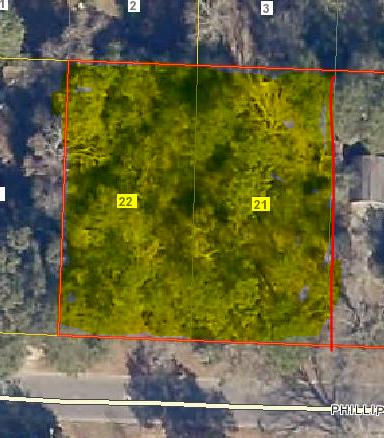 Nice wooded lot with large oak trees . Survey would have to determine storage shed location and/or lot line . Electricity for the shed would have to be separated from the house.