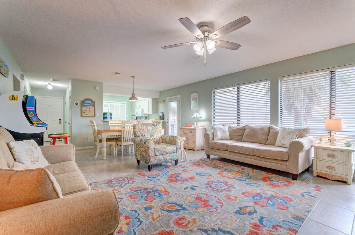 Discover the incredible opportunity to own a stunning beach vacation home! This fully furnished condo, situated on the second floor, boasts 2 bedrooms, 2 full baths, & is just steps away from the breathtaking Emerald Coast. The interior flows with tile flooring throughout, ensuring both durability & effortless maintenance--perfect for a beachside retreat. Enjoy leisurely moments on the balcony overlooking the pool or get your vitamin C by the Sea with easy access to the pristine beaches just a stone's throw from this cozy haven. Whether you choose to move in full-time, become a seasonal snowbird, or invest in a vacation rental- this is for you! This condo is currently on a short-term rental program. Don't miss out on this exceptional opportunity; Make this slice of paradise yours now!