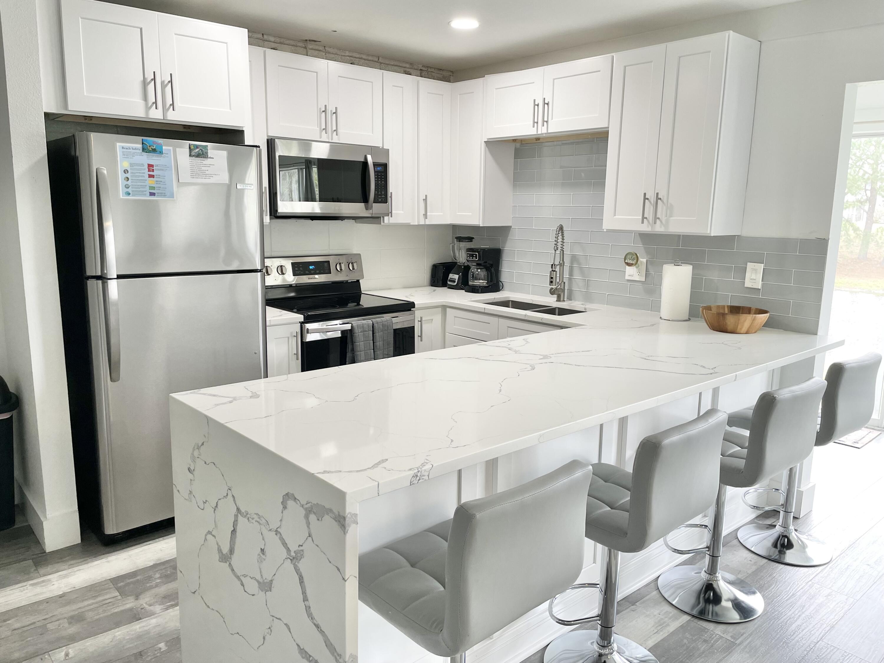 Buyer had change of plans, back on the market at no fault of seller! Completely updated and turn key condo located in central Destin. Open kitchen overlooks the living area and offers updated cabinets, granite countertops and stainless appliances. The patio has been enclosed to add more room and sq. footage. Floor to ceiling windows let you enjoy the beautiful lake view while sipping on your morning coffee. Brand new HVAC unit and hot water heater installed in 2023. The bathroom has also been updated with a walk in shower. Washer and drier in unit. Offered furnished and ready to rent or move in.Gulf terrace has 3 pools, tennis court and picnic areas. It is located within walking distance to restaurants, shopping and entertainment and just a couple minutes to a public beach.