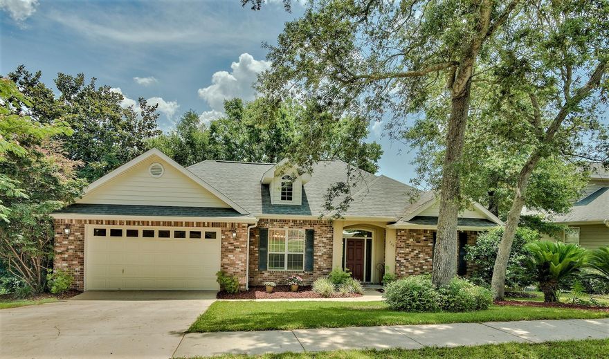 DISCOVER ''THE WOODCREST'' -- a home built by one of Niceville's top-rated builders. This home is perfectly nestled between mature trees, overlooking Beaver Creek. The property offers a small pond & waterfall that would be great as a Koi pond. The multi-level deck and screened-in back porch over-looking the creek provide you with a fabulous BIRD WATCHING & WILDLIFE OBSERVATION point(s). You will feel like you are secluded in the country while living in the heart of Niceville, in very close proximity to shopping centers, restaurants, golf, marinas, EGLIN AFB and Florida's top rated SCHOOLS. A notable feature is the WALK-OUT BASEMENT giving this home a unique ''split'' plan between the master bedroom/ensuite master bathroom on the main floor and the additional 3BDR/2Bath on the lower level