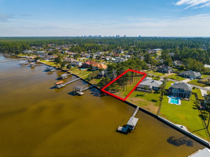 TRANQUIL BAYFRONT OPPORTUNITY | 101.1' OF WEST BAY FRONTAGE WITH GULF ACCESSCreate your legacy home at 306 Moonlight Bay Drive, a rare bayfront homesite on the peaceful shores of West Bay in Panama City Beach. This buildable parcel offers 101.1 feet of bay frontage and features a fortified seawall already in place, providing shoreline protection and long-term value. Surrounded by a slow-moving saltwater marsh, the setting is serene and naturally beautiful. Located within a designated West Bay sector plan, the area's resources are preserved for the future. Enjoy a 25-minute boat ride to the turquoise waters of the Gulf of Mexico, while remaining close to shopping, dining, golf, and the white-sand beaches of Panama City Beach. Surrounded by a slow-moving saltwater marsh, the setting is serene and naturally beautiful. Located within a designated West Bay sector plan, the area's resources are preserved for the future. Enjoy a 25-minute boat ride to the turquoise waters of the Gulf of Mexico, while remaining close to shopping, dining, golf, and the white-sand beaches of Panama City Beach.