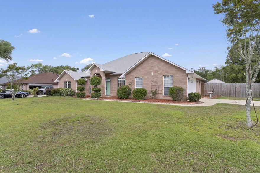 Welcome to this spacious 4-bedroom, 3-bath home located in the ever-popular Crown Pointe neighborhood! Sitting on a desirable corner lot that's nearly a third of an acre, this thoughtfully designed home offers over 3,000 sq ft of practical living space--perfect for hosting, everyday living & keeping everyone comfortably accommodated. Inside, you'll find a smart split floorplan and ceramic tile throughout, with vaulted ceilings in both the living & family rooms, offering multiple spaces to relax, work, or entertain. The Florida room is filled with natural light & makes a great year-round spot for hobbies, play, or simply unwinding. A gas fireplace adds a cozy touch for cooler nights. The kitchen is roomy with plenty of cabinet space, custom cabinets, granite countertops, BRAND NEW microwave  NEW dishwasher, like-new double oven is approximately 3 years new & a large eat-in areaplus a separate formal dining room for extra flexibility. Two sets of double French doors provide privacy when needed & open up to the Florida room, blending the indoor & outdoor feel. The primary bedroom features a trey ceiling, a large ensuite bath with double vanity, soaking tub, separate shower, & two generous closets. Three additional bedrooms are extremely sizable & the two full baths make this home ideal. Outside, enjoy a screened-in patio with new screening that works great for relaxing, playtime, or casual get-togethers. The exterior also features a sprinkler system on a well with a NEW SPRINKLER SYSTEM PUMP! The side-entry two-car garage offers extra storage space & easy access. Major updates include a 2021 roof, approximately 6-year-old HVAC system, & a newly installed gas water heaterso you can move in with confidence. The fridge in garage conveys! Conveniently located near Perdido Key beaches, NAS, Downtown Pensacola, Perdido Bay & local shops, schools, & parksthis home combines space, comfort & everyday convenience in one great package.  Buyer to verify all info