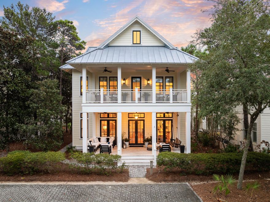 Welcome to WaterColor Phase III, where this stunning beach house embodies the best of the Sand Hill lifestyle. Ideally situated near the beloved Frog Pool at Sandhill Circle, this luxury residence is one of just 24 homes in the neighborhood, offering access to a community pool and a charming pocket park. Set back from the paved street, the home welcomes you with an expansive covered front porch, perfect for unwinding with a refreshing drink on balmy coastal evenings.Inside, tall, bright rooms with soaring ceilings create a spacious and sociable atmosphere, while fresh paint and stylish furnishings make this an attractive investment opportunity. The main sitting room features beautifully crafted wooden shiplap walls and durable LVP flooring that extend into the formal dining area. The seamless open floor plan invites effortless entertaining and memorable gatherings, whether you choose this as a vacation retreat or a permanent residence.

At the heart of the home, the open-concept kitchen is both sophisticated and functional, centering around a marble-topped island with a farmhouse sink, a Sharp microwave drawer, dishwasher, built-in wine rack, and seating for four. Elegant glass-front cabinets with display lighting provide ample storage, complementing the stainless steel appliances, vented hood, and Thermador six-burner gas range. A gleaming subway tile backsplash adds a timeless touch to the space.

A rear hallway leads to a convenient half bath and continues into a well-appointed mudroom with a laundry area and sink. Beyond, a glass door opens onto a covered wooden deck with steps leading to a paved barbecue terrace, creating the perfect setting for alfresco dining and outdoor entertaining.

Five exquisite bedrooms offer comfort and tranquility, including a first-floor primary suite complete with a private ensuite featuring a twin vanity, a tiled walk-in shower, and a luxurious soaking tub. French doors open directly onto the porch, inviting gentle coastal breezes. Upstairs, a thoughtfully designed layout includes a large bunk room with two sets of twin bunks and a sleeper sofaideal for hosting guests. The king-sized primary suite boasts its own lavish ensuite with a garden tub, separate shower, and an extended double vanity. A Jack-and-Jill bathroom conveniently serves the third bedroom and is accessible from the upper hall, while the fourth bedroom is a bright, inviting space with doors opening onto the wide upper balcony, perfect for serene mornings and treetop views.

The home's exterior is equally impressive, featuring a covered parking area, bike storage, lounge chair storage, and an outdoor shower for rinsing off after a day at the beach. Additionally, the property offers ample room to add a carriage house and a private pool, enhancing its appeal as an ultimate WaterColor retreat.

Just a short golf cart ride from community pools, a fitness center, jogging trails, and the private beach club, this home offers easy access to all the best amenities of WaterColor. Ride your bike to Seaside for boutique shopping and oceanfront dining, or explore Western Lake by kayak or paddleboard, immersing yourself in the beauty of Florida's rare coastal dune lakes. Surrounded by nature, world-class dining, and some of the most pristine beaches in the country, this exceptional home presents a rare opportunity to experience the best of 30A living.
