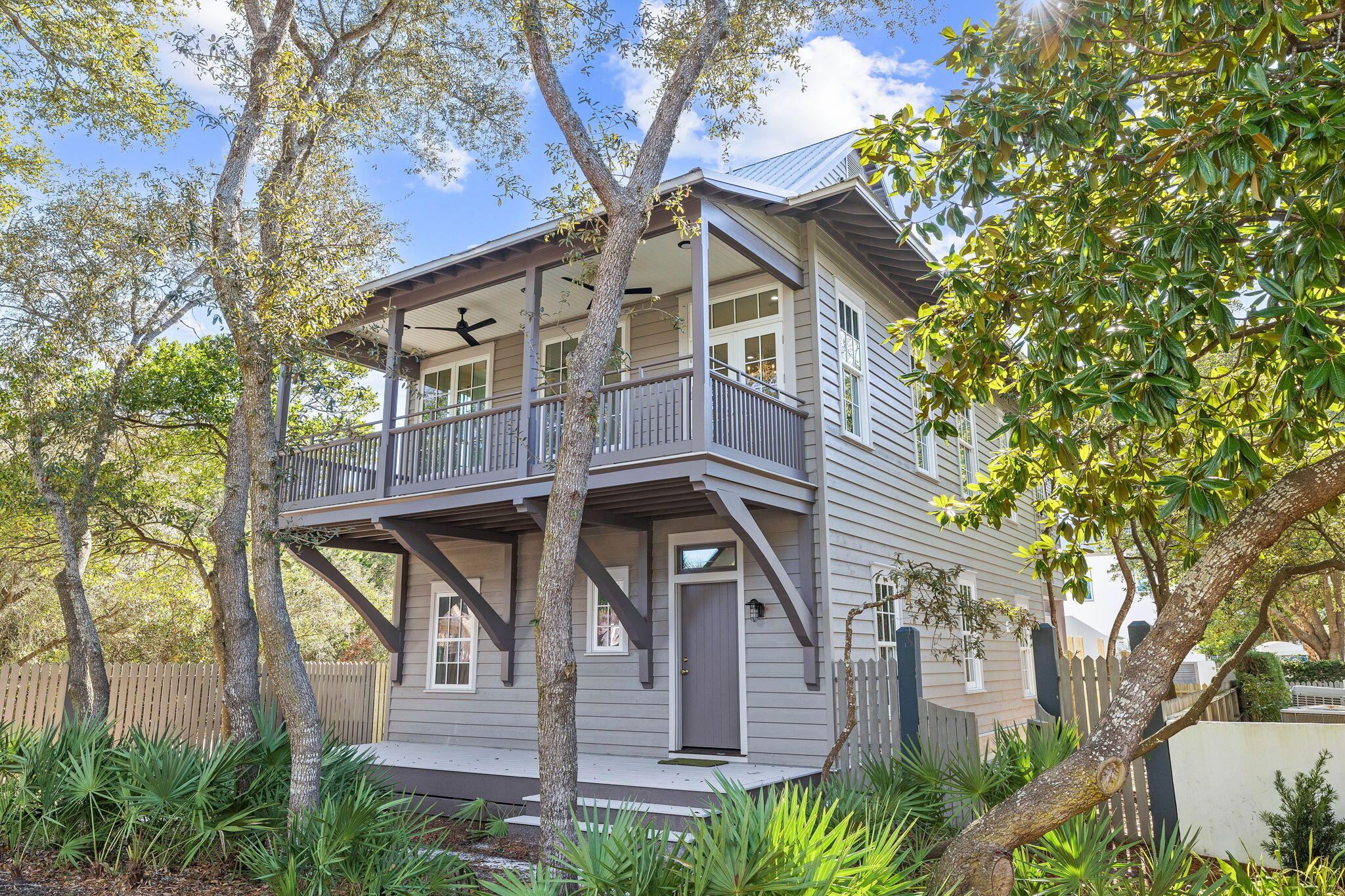 Located on the coveted south side of the Rosemary Beach community, this fully remodeled home masterfully blends coastal elegance with modern functionality. Designed by acclaimed architect Robert Orr, the residence reflects the timeless European colonial architecture of the Dutch West Indies, with its elevated masonry foundation, deep porches, and lofty ceilings. The main house offers 4 bedrooms, 4.5 bathrooms, and a bunk room providing plenty of space for family and guests. The inviting front porch leads to a thoughtfully designed first floor featuring two-bedroom suites, a charming enclosed bunk area, and stunning wood flooring throughout. The second floor boasts an open-concept living area and kitchen, seamlessly blending functionality and style, alongside an additional bedroom suite with an en-suite bathroom and private balcony overlooking the lush park behind the property.

The third floor, accessed by a spiral staircase, is a private retreat dedicated to a luxurious guest suite. Adding to the property's appeal, the coach house offers a fully equipped living space with a kitchen, dining area, laundry room, and bedroom. The backyard is an oasis of relaxation, featuring a private pool perfect for entertaining or unwinding after a day at the beach.

Nestled within the thoughtfully planned Rosemary Beach community, the residence is surrounded by verdant greenery and connected by scenic boardwalks and paths that weave through the neighborhood. Residents enjoy exclusive amenities, including an Owners' Pavilion, multiple community pools, green spaces, and deeded beach access. The community's year-round eventssuch as live concerts, movie nights, festivals, and weekly farmers' marketscreate a vibrant and welcoming atmosphere.

Situated just moments from 30A's world-class dining, shopping, and entertainment, 25 St George's Lane combines an unbeatable location with exceptional rental potential, making it an ideal investment or a dream full-time residence. Schedule your private tour today and experience the epitome of coastal living.
