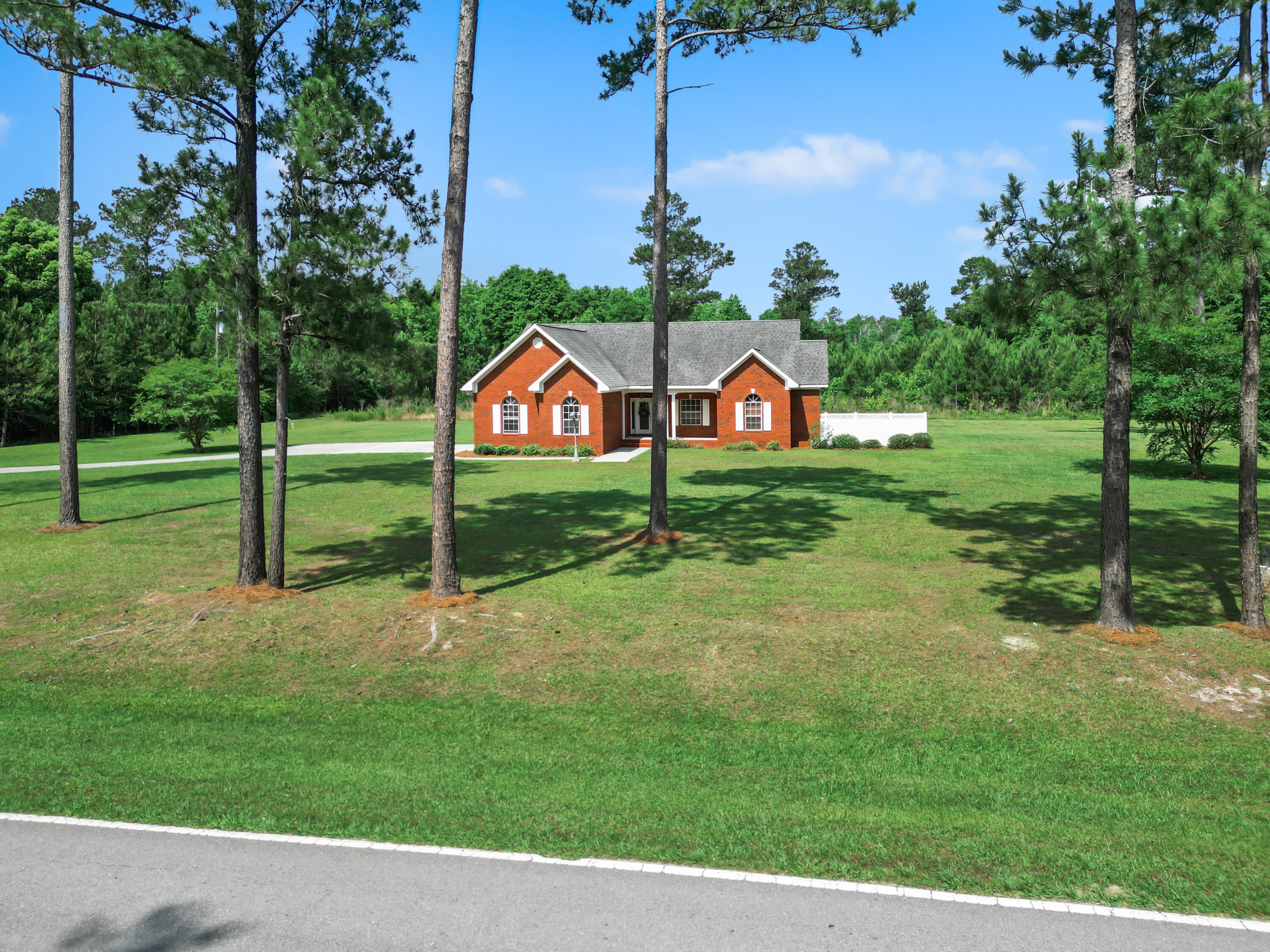 CURRENTLY UNDER CONTRACT, SELLER WILL CONSIDER BACKUP OFFERSWelcome to 13761 NW Pea Ridge Rd in Bristol, FL (Liberty County)--a well-maintained 3BR/2BA brick home with 2-car garage on 6.19 acres, no HOA. Surrounded by mature pines and open green space, it offers privacy and room to roam. Inside features vaulted ceilings, warm tones, solid wood cabinets, modern appliances, and a central island. Enjoy the formal dining room, spacious backyard, extended driveway, and a peaceful pond tucked in the back. Located just 1 hour from Mexico Beach and Tallahassee, and minutes from the Bristol Boat Landing and Apalachicola National Forest.