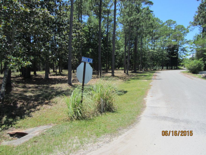 Beautiful corner lot in a small 15 lot subdivision. The lot has large magnolia and oak trees with underground utilities available at the site. Paved road frontage on River Circle is 324 feet. There is no build-out time requirement. The lot is clear of underbrush and can be easily walked. This is one of the larger lots in the subdivision. The location is very convenient being close to shopping, hospital, doctor offices, and quality restaurants as well as only minutes from the beautiful beaches of South Walton. A survey is available upon request.