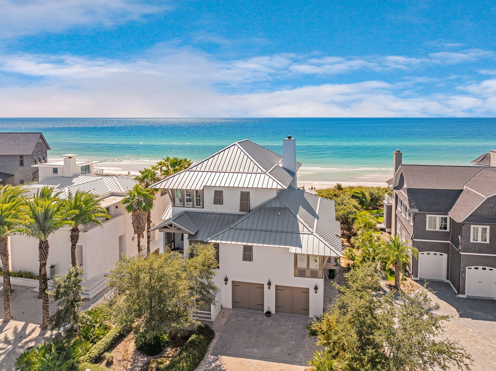 Tucked within the gated, rental-restricted enclave of Camp Creek Point, this exquisite all-concrete home presides over 75 feet of the most private and serene beachfront the East end of 30A has to offer. One of only 16 homesites on Camp Creek Point, this pristine, 4 bedroom, 6 bathroom gulf front property provides the perfect escape from the hustle of everyday life. Approaching from the front of the residence, a landscaped pathway leads to peacock paver stairs adorned with custom concrete planters that guide you to the main entrance located on the second level of the home. Step into the foyer where you are greeted immediately by stunning gulf views. The heart of the home is the open floorplan living area with a gulf front living room featuring a newly shiplapped mantle and wood burning fireplace flanked on either side by custom built-in cabinetry. Adjacent to the living space is a chef's kitchen, outfitted with top-of-the-line Thermador appliances, including dual ovens, a six-burner gas range, and sizable island, complete with a prep sink. A cozy breakfast nook with shuttered windows is the perfect place for morning coffee, while the dining area enjoys outstanding water views. French doors off the living space open to the newly refinished pool deck surrounding your gulf-facing pool and spa. The pool deck is lined by lush greenery and magnolia trees, providing ample privacy to the pool and outdoor seating and dining areas. Your personal boardwalk, recently refinished with new Trex decking and complete with seating, is screened by mature vegetation rooted into the dunes, and leads to your very own stretch of private beach and access to the famous sugar-white sand and azure waters of the Gulf of Mexico.

The primary suite on the main level serves as a serene retreat with dual closets, a private office, and a westward facing side balcony. The luxurious en suite bath includes a soaking tub and walk-in shower. Enjoy gulf vistas as you step out onto the attached screened porch with louvered privacy that leads to the expansive pool deck perfect for soaking up the Florida sun.

Upstairs, you'll find three additional bedrooms, each with its own ensuite bath and generous storage. The first guest room features custom-built bunk beds, perfect for accommodating younger guests. The second offers panoramic windows that bathe the room in natural light. Gulf vistas abound on the secondary primary suite on this level that opens to an oversized balcony with ample seating and a peaceful swing bed overlooking the water, providing an idyllic spot to unwind while enjoying the coastal breeze and mesmerizing sunsets.

A dual-bay garage with plenty of storage provides security and easy access to the property from the ground level. Entering through the garage allows for access to the newly finished, heated and cooled first level, complete with new floors and shiplap walls. The first level bonus rooms a perfect location for an exercise space, game room, or office. Other recent updates to the home include fresh interior and exterior paint, two new hot water heaters and condensers. New furniture pieces throughout the house further enhance this incredible home.

Camp Creek Point is located just minutes from the luxury destinations of Watersound, Alys Beach, and Rosemary Beach, this exceptional home combines seclusion with close proximity to the finest dining, shopping, and entertainment along South Walton's Emerald Coast.