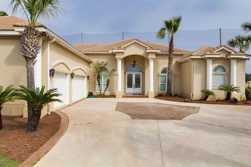 Custom built home overlooking the golf course at Emerald Bay!In a quiet cul-de-sac in the Baywinds neighborhood,this open floor plan is ideal for family and entertaining with formal living, dining rooms, open chef's kitchen/breakfast area and family room all centered around a large lanai and pool with a five foot stucco privacy fence. Own your tropical oasis complete with mature orange trees! This home has four bedrooms, two and a half baths with an additional poolside half bath and a study. The master suite is grand with a fireplace and lanai access. The master bath has two walk-in closets, separate walk-in shower, jetted tub and double vanities.Features include raised ceilings,upgraded appliances, marble floors,custom built-ins,crown molding,surround sound, and triple garag