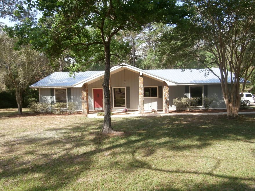 Motivated seller for this totally renovated home. This 3/2 home is like new. Home has split floor plan and sits on 1.29 acres.If you are looking for a nice home with privacy this is it. Home has new kitchen, baths, roof, exterior and interior paint, flooring,light fixtures, interior doors, ceiling fans, appliances and hot water heater. This is a must see.