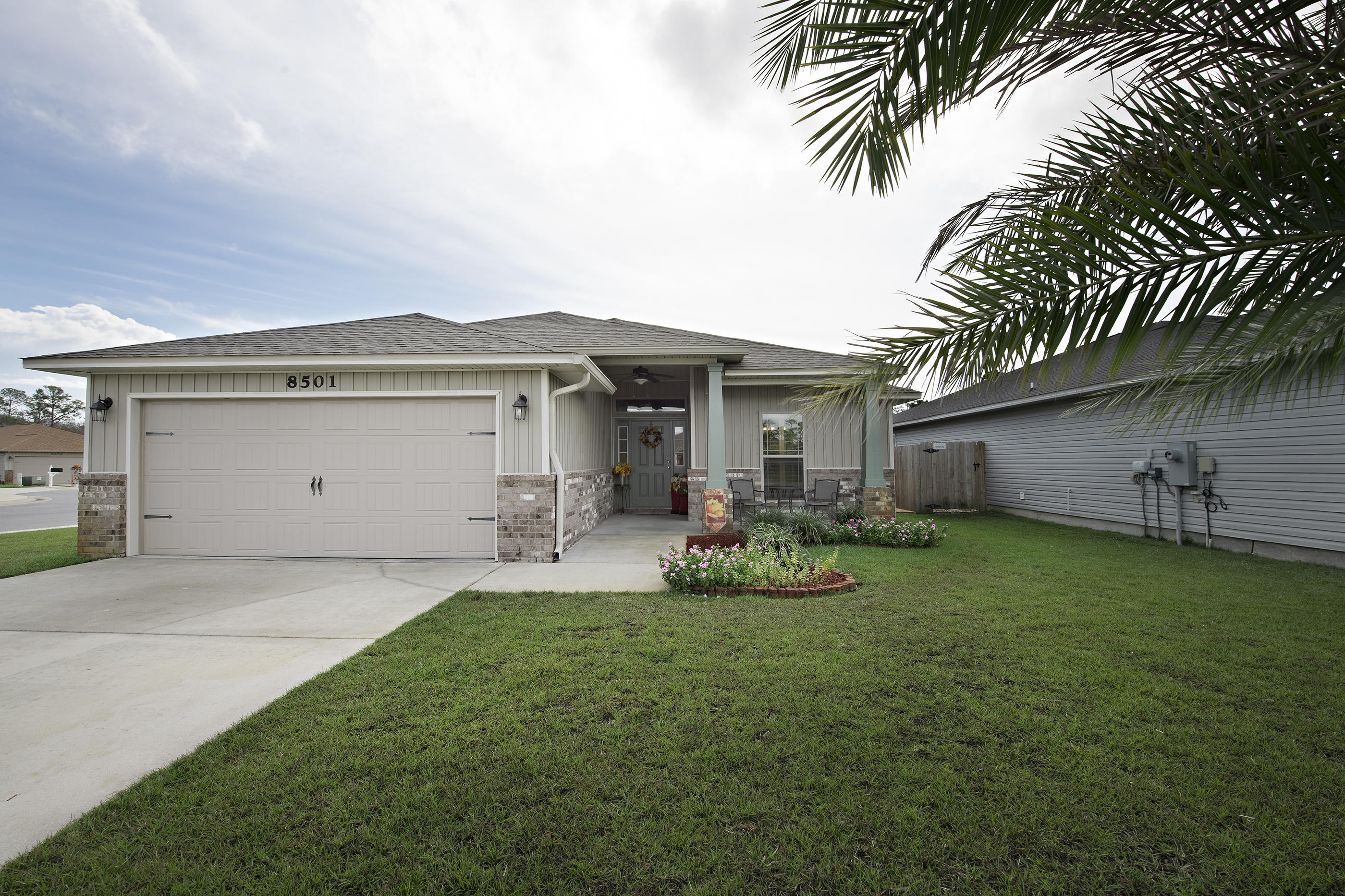 Beatuiful Home on a corner lot right next to a cul de sac. The school bus stops right in front of the home in a rare neighboorhood with side walks in Navarre. Beautifully maintained and upgraded 4 Bedroom 2 Bathroom home. Kitchen with granite coutnertops including the island, stainless steel applainces, walk in pantry and much more! Built in Desk across from the Kitchen! Tiled Screened in Rear covered porch! Custom Wooden Blinds, and so much more! Make sure you come see this great home before it is gone!