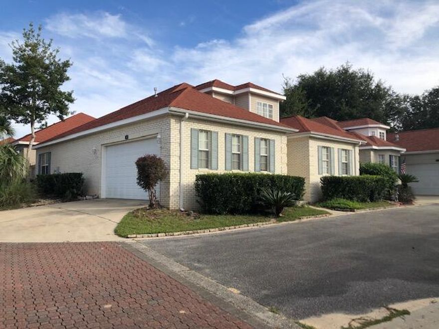 Beautiful Mediterranean style home located in a gated community within Bluewater Bay. This home boasts an open floor plan with a master bathroom with a jacuzzi tub and walk-in shower. There is tile in the main area and new carpet in the bedrooms and paint throughout. The home is on a corner lot with a side entry garage.