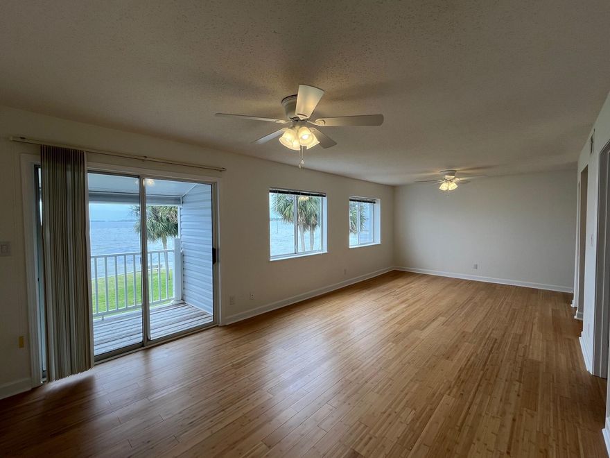 NEW LOWER PRICE for this WATERFRONT unit in Finisterra; RENOVATED from the top to the bottom to include kitchen and bathrooms, flooring, paint and fixtures! This condo in Shalimar is a hidden GEM.  The panoramic bay views from this 2 bedroom unit are AMAZING and it could be used as a carefree primary residence or a second home. This unit comes with a designated parking spot in front and Finisterra offers an array of fantastic amenities, including a swimming pool, tennis courts, a convenient laundry facility, gated access, inviting waterfront sitting areas, outdoor grills, and more! The complex is a non-rental community for the first two years of ownership, however, after two years, the owner has the ability to rent long-term but please note that short-term rentals are not permitted.