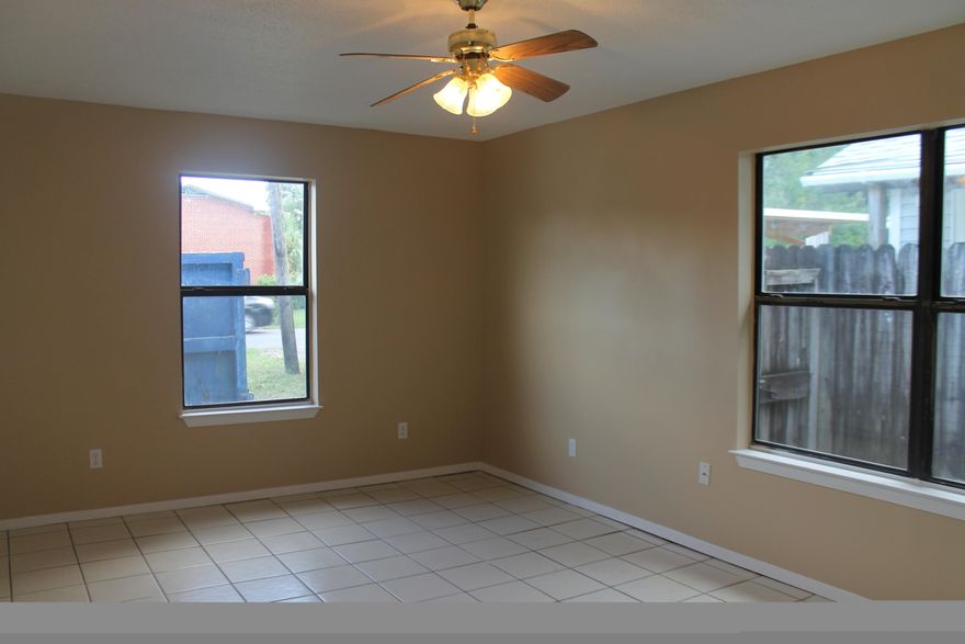 You will love this newly remodeled 3 bedroom, 2 bath house! When you walk in the front door you will notice the new tile throughout the entire house. The living room has just been painted with neutral colors and features a ceiling fan. The kitchen has a stainless fridge, dishwasher, and new stove. Nice sized bedrooms with new paint and tile floors. The roof and air conditioning system is new for energy efficiency. Exterior of the home has just been painted! It has a privacy fenced back yard to complete this perfect property.