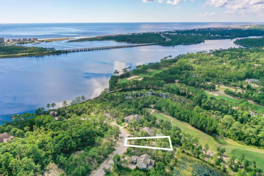 This vacant lot is on a cul-de sac street of fine homes and is ready for a full-time home or a vacation retreat in the coastal community of Wild Heron. Wild Heron is a gated community along the scenic shores of Lake Powell, one of the Panhandle's amazing coastal dune lakes. Golf lovers will enjoy Wild Heron as the award-winning Shark's Tooth Golf Club, designed by Greg Norman, which runs throughout the neighborhood. The community also offers tennis courts, boardwalks, trails, swimming pool, fitness center and a boathouse stocked with kayaks and canoes for residents' use. Enjoy all the communities, shops and restaurants nearby along Scenic 30A. Lot dimensions are approximate and should be verified by the buyer.