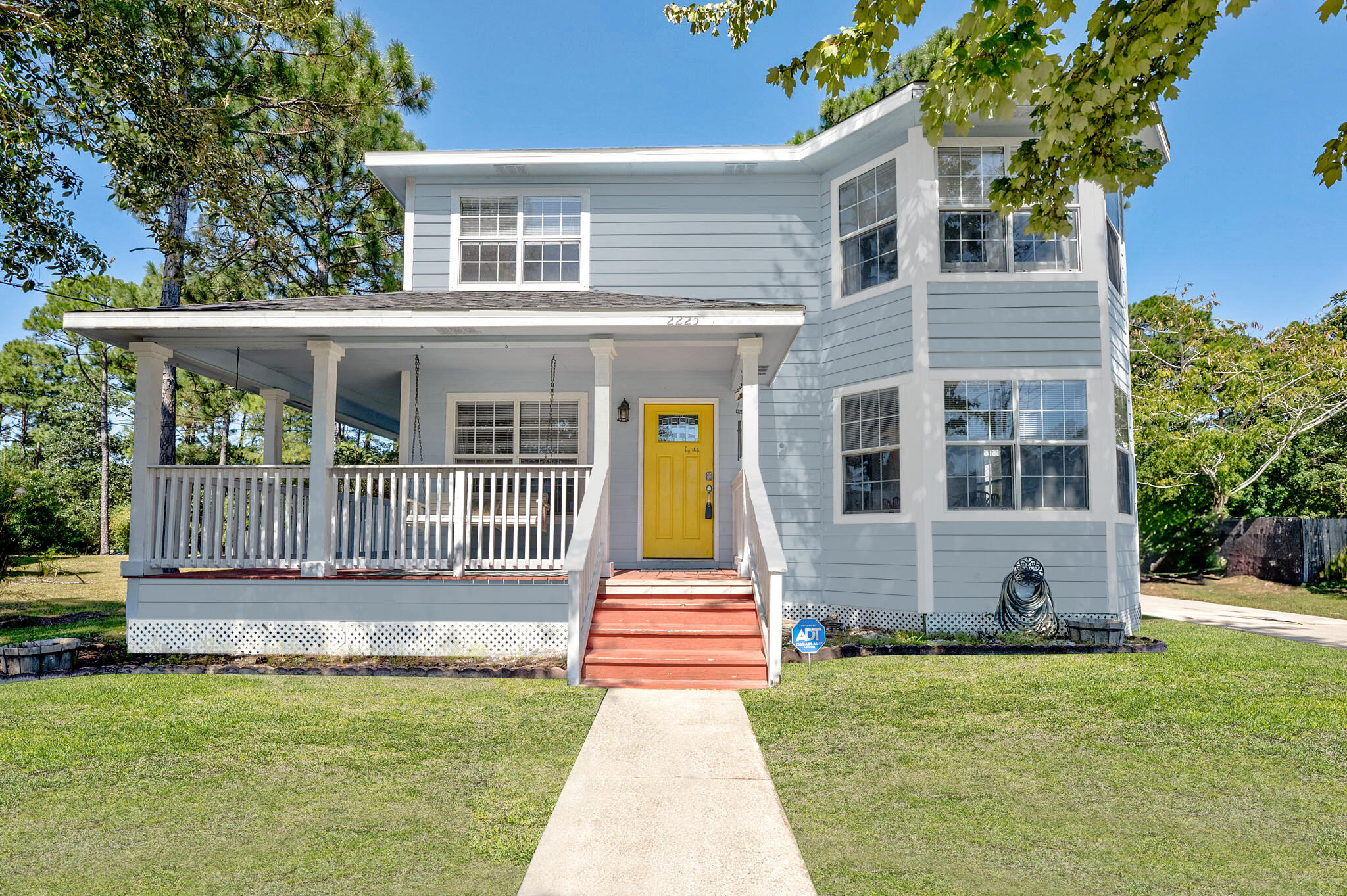 Nestled on a quiet street in Navarre, this 3-bedroom, 2.5-bath home sits on nearly half an acre (0.47 acres). Plus, it backs up to over 80+ acres of greenspace, offering long-term privacy and serene natural views. Previously used as an investment property with over $31k of income. The roof, only 5 years old, offers long-term security and peace of mind. The exterior features a charming wrap-around porch with a glider swing, while the screened back porch opens to a pergola, firepit, and a large shed--perfect for storage or small projects. Inside, enjoy a cozy living space with a fireplace, a formal dining room, and a chef's kitchen complete with new cabinetry, countertops, and a stylish backsplash. The kitchen is equipped with stainless steel Panasonic appliances and a built-in pantry. All t hree bedrooms are located upstairs, each offering tranquil views. The primary suite boasts a bay window seating area, a walk-in closet, and an en-suite bathroom with a quartz double vanity and a tub/shower combo. Conveniently located near shopping, dining, Navarre Beach, and Hurlburt Field, this property balances coastal living with investment potential. Whether you're seeking a peaceful retreat or looking to capitalize on the short-term rental market, this home is a prime opportunity in one of Navarre's most desirable areas!