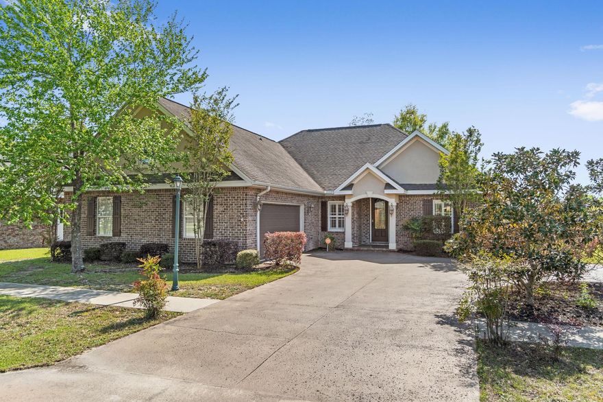 An exceptional home: this custom home on a corner lot leading to a cul-de-sac was constructed in 2010. This open concept home offers four well sized Bedrooms & three bathrooms. Its features include raised coffered & trey ceilings, plantation shutters, crown molding and custom mantels, and laminate wood floors. The kitchen has quality wood cabinets with granite countertops, pantry, gas stove, and eat-in area. The Florida room and family room share a double fireplace. At the front of the home is the perfect space for a formal dining or a sitting area. This space effortlessly transitions into the living room/kitchen area open to the Florida room. Outside is a fully enclosed backyard, cement patio and built in charcoal grill. The primary suite is sure to impress with its custom ceiling and