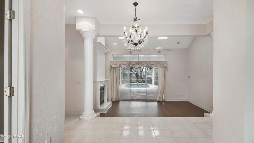 Large Home with 2 separate living spaces each with a fireplace, formal dining, and eat-in breakfast nook. Huge outdoor space with screened lanai and large inground pool. Mature landscaping with multiple fruit trees. Conveniently located off of North Lagoon with easy access to the beaches and marinas.