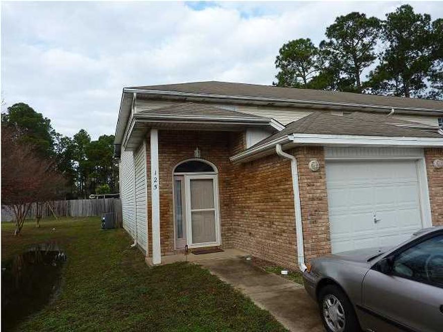 Beautiful townhouse loaded with upgrades and extras in a quiet neighborhood close to Hurlburt Field. Kitchen all stainless appliances, GE side-by-side fridge with ice and water (filtered), Maytag double oven smooth top range, GE stainless dishwasher and a stainless built in microwave. Covered screened patio (only one in the complex). Lots of upgraded lighting. Dining and den combo, washer/dryer hookups, garage with remote, privacy fenced back yard with drive thru gate and slab (boat storage). Patio and upstairs balcony are 8x20. Lawn front and side cut by HOA. The back yard is your only responsibility to maintain. Downstairs hardwood entry and the rest tiled with large 18x18 tiles. Sorry no pets.