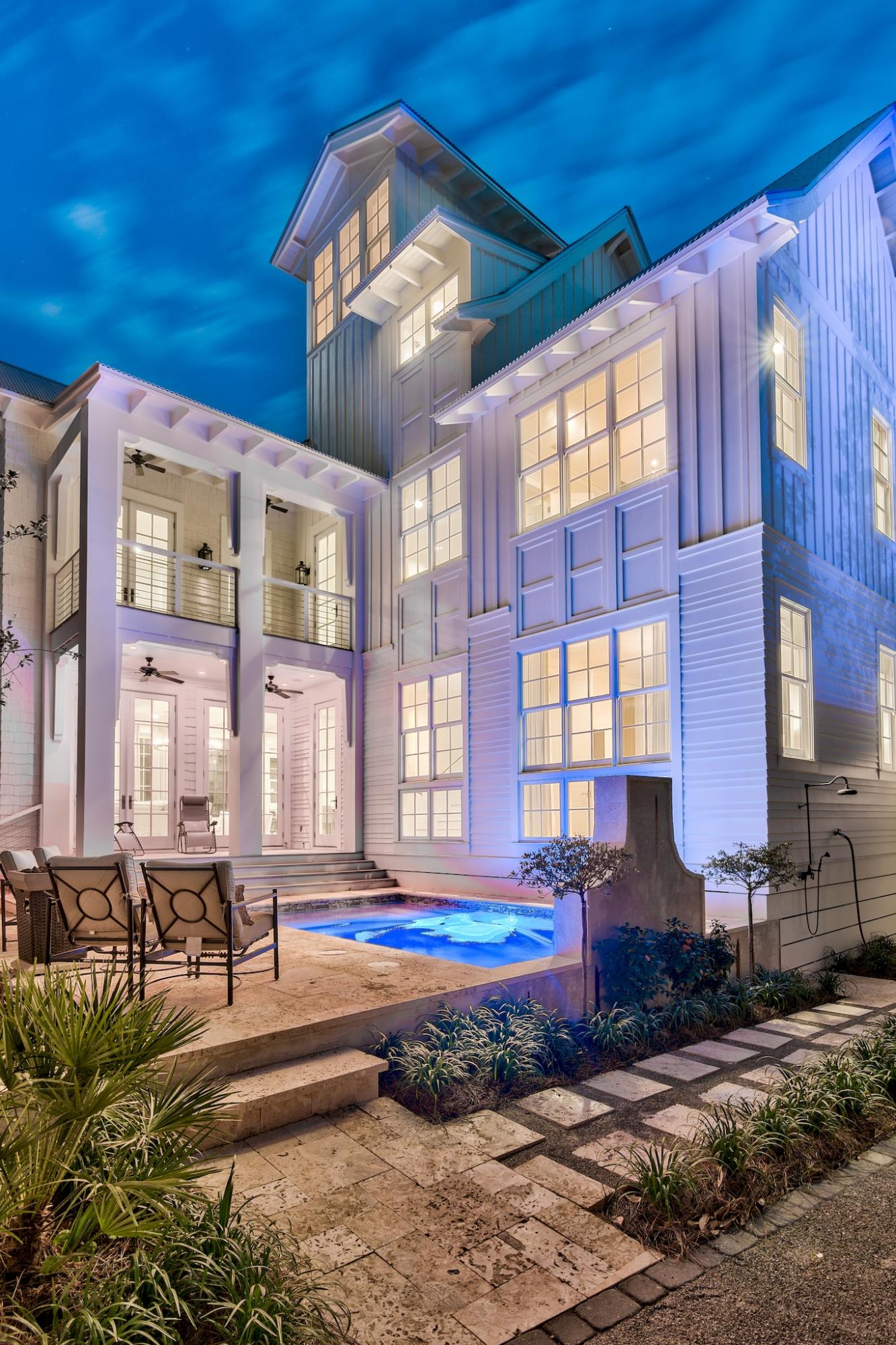 This luxurious home situated on a corner lot one block from the Gulf in Old Seagrove is the ideal beach home. Boasting 6 bedrooms, 7 bathrooms, this home offers plenty of room to relax with its spacious, open-concept floor plan and 4,611 sq ft. Features of this home include a gourmet kitchen, oak floors, shiplap walls, carrera counter tops, 12' oak beamed ceilings, floor to ceiling windows, 2 master bedrooms (one located on the 1st floor, the other on the second floor), ensuite baths, private pool, and a circular staircase that takes you to the tower to view the beautiful Gulf Coast sunsets.