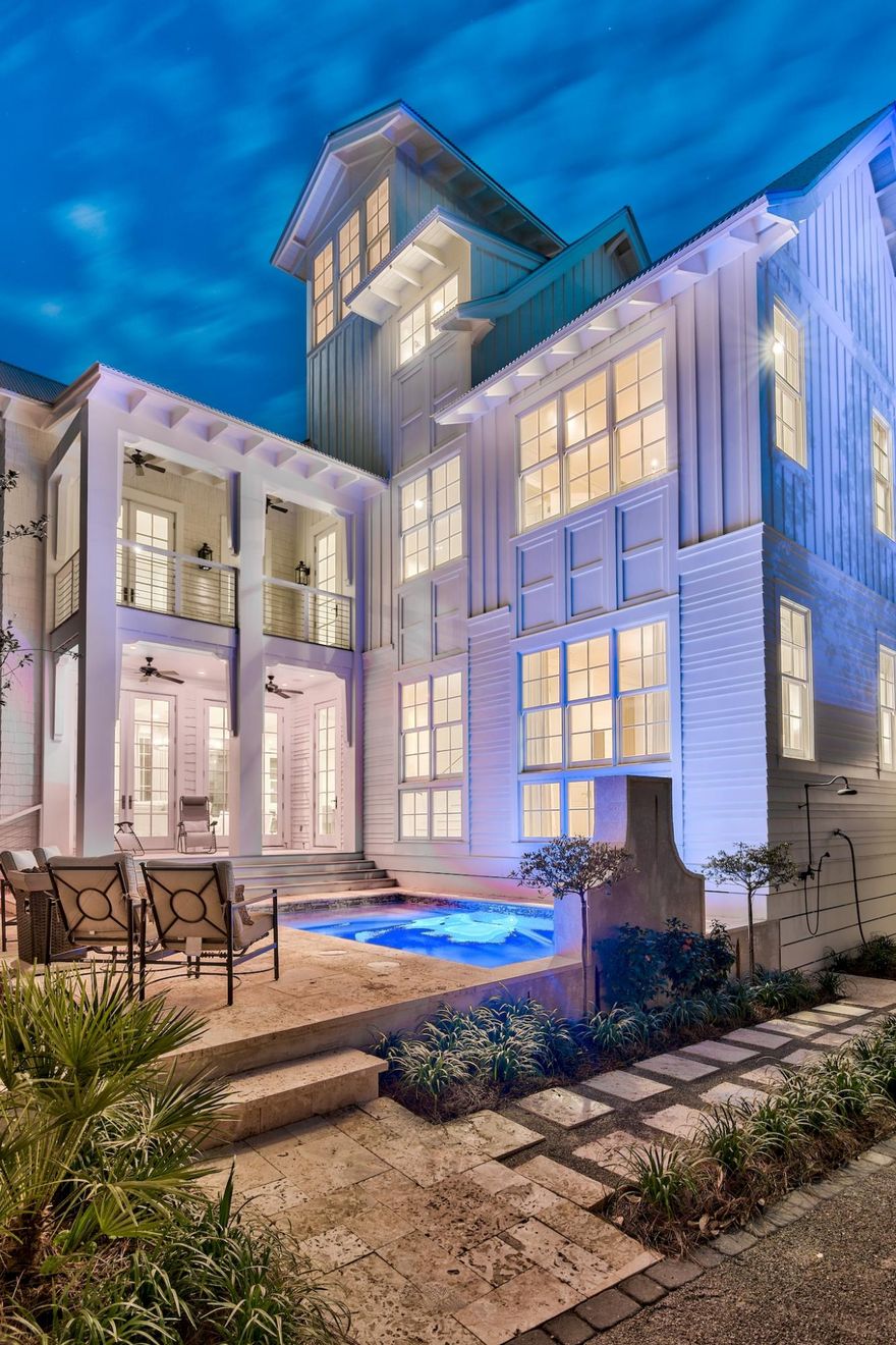 This luxurious home situated on a corner lot one block from the Gulf in Old Seagrove is the ideal beach home. Boasting 6 bedrooms, 7 bathrooms, this home offers plenty of room to relax with its spacious, open-concept floor plan and 4,611 sq ft. Features of this home include a gourmet kitchen, oak floors, shiplap walls, carrera counter tops, 12' oak beamed ceilings, floor to ceiling windows, 2 master bedrooms (one located on the 1st floor, the other on the second floor), ensuite baths, private pool, and a circular staircase that takes you to the tower to view the beautiful Gulf Coast sunsets.