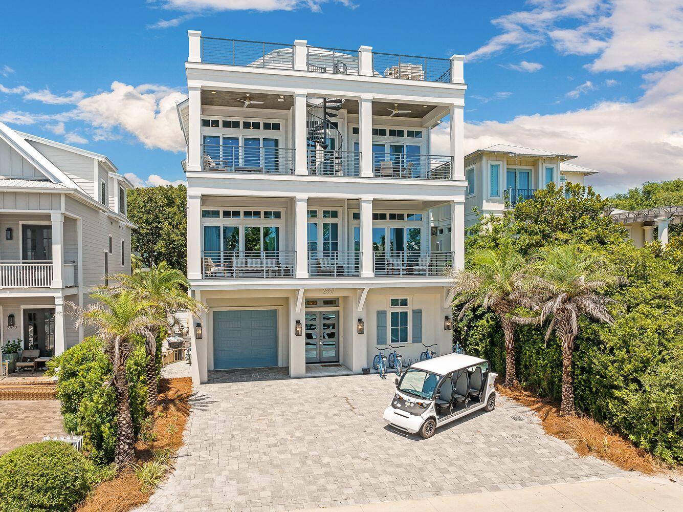 Discover unparalleled elegance in this luxury home located on 30A, nestled between the renowned Surfing Deer and Seaside. This exceptional Seagrove Beach property boasts breathtaking panoramic Gulf views and a remarkable rental income grossing up to $320,000. Encompassing over 5,200 square feet of meticulously designed living space, along with an additional 2,500 square feet of inviting porches, this six-bedroom, seven and one half bath haven is across from the Live Oak Beach access.Step inside and experience the exquisite modern interiors, accentuated by tasteful designer finishes that create a seamless blend of sophistication and style. The first level features a game room that opens to a stunning lanai accentuated with a fireplace, outdoor grill, and heated saltwater pool, and full pool bath.
Experience the timeless elegance of an exquisite travertine pool deck, elegantly surrounded by an abundance of palm trees that enhance your privacy. This luxurious outdoor oasis invites relaxation and tranquility, making it the perfect retreat for sun-soaked days and starlit evenings.
The bunk room, accommodating four, includes two sets of full/full bunks with a private ensuite bath.
The second floor is dedicated to the owner's retreat, complete with a walk-in closet and a luxurious private bath featuring a shower, dual vanity, and a soaking tub with Gulf of America vistas with balcony access overlooking 30A. Three additional bedrooms, one with gulf views and balcony, ensuite baths, and second laundry area adds convenience.
Ascend on the elevator to the third floor with a sleek wet bar equipped with a wine refrigerator and ice machine. The gourmet kitchen showcases a dynamic quartzite island, Wolf appliances, including a double gas range, exhaust hood, dual dishwashers, SubZero refrigerator, and convection oven overlooking the elegant dining area with endless gulf views.
Enhancing your outdoor living space are dual euro doors creating an outdoor entertainment oasis with room for outdoor dining or overflow guests.
The crowning glory is the fourth level rooftop sun deck, offering breathtaking 360-degree views of the Gulf, ideal for sunrise and sunset memories of a lifetime.
The sixth bedroom with a king bed and ensuite bath completes the third floor, with a half bath for guests.
Exquisitely appointed and offered fully furnished with elegant hand screen-printed wallpaper, custom tile and fixtures hand picked in each space fulfills the sophisticated palette.
For those who prioritize living and vacationing along 30A, this home offers walking 150 feet to the scenic Gulf of Mexico and Seaside; perfect for the avid beach connoisseur seeking the luxury 30A lifestyle.