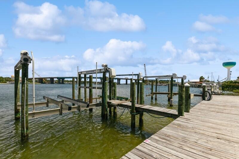 Sellers to pay monthly HOA fees of $1066.65 through 12/31/23 at closing on behalf of buyer! Magnificent sunsets, holiday fireworks, boat life & Island living are all yours with this gorgeous ''smart'' condo! Spectacular renovation! Voice-controlled blinds, ceiling fans, lighting, thermostat & front door locks can be controlled from anywhere! New LVP flooring, custom backsplash, quartz countertops, barn-door feature, two balconies, incredible master closet, renovated baths, abundant storage, plantation shutters & recessed lighting all meld together to create a relaxed, colorful, coastal vibe! Purchase includes 36' boat slip w/16,000# lift, electricity & water, assigned parking, locker & mailbox! OR Buy 1 unit & get 2 rentals! Units have separate entrances & could be configured as 2 units!