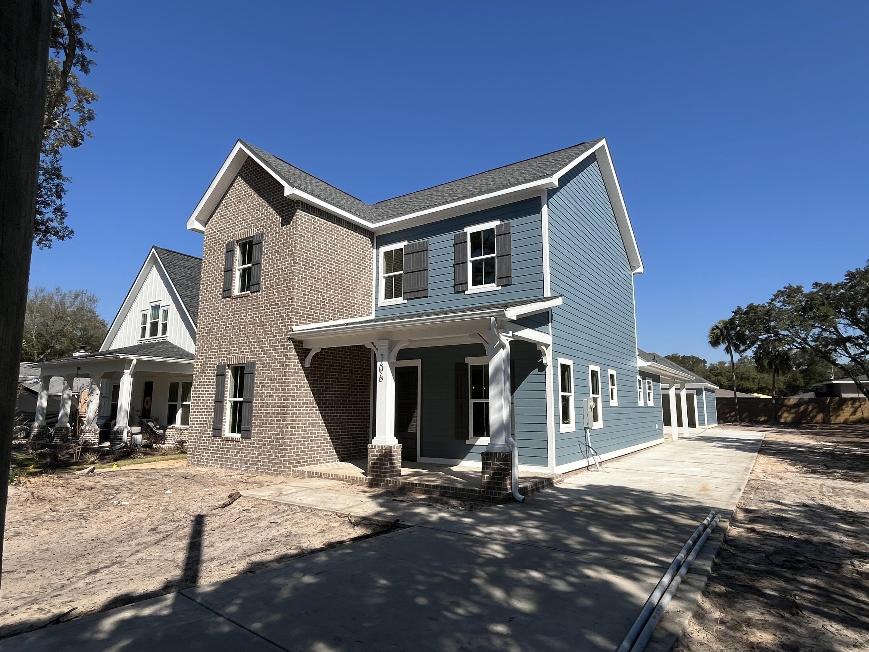 Welcome to this beautiful 5 bedroom, 3.5 bath, 3 car garage, New Construction home located directly across the street from water access w/ a beach in Shalimar, FL! As you enter this home you are greeted by an abundance of natural light radiating throughout the main living area and formal dining room. The focal point of the living room is a floor to ceiling brick fireplace perfect for cool Florida nights. The kitchen offers ample counter space, quartz countertops, GE appliances to include a french door fridge, natural gas stove, custom hood vent and a beverage fridge.  The master bathroom is a true spa-like retreat with his and her vanities, a soaking tub, walk-in shower and unique accent tile.  Do not miss the shiplap in the 1/2 bath and custom mudroom bench. With two on-suites on the main floor, 3 additional bedrooms upstairs with a bathroom and loft area there is a space for everyone. Enjoy hosting dinners on the 22 foot long screened in back porch while watching the kids and dogs play in the backyard. This home is truly a gem! HOUSE WILL BE COMPLETE & READY TO CLOSE BY: 3/31/2025!   *When onsite make sure to walk across the street and take a look at the waterfront park! 