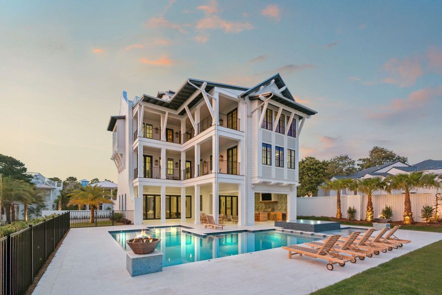 Welcome to the Bluffs on 30A, an exceptional new construction opportunity that flawlessly pairs the relaxed elegance of beach town living with the finest in modern luxury and exceptional architectural design. Purpose built and designed for resort style living while yielding an exceptional scale and level of privacy, this oversized homesite boasts an exemplary 100' of width allowing for unparalleled amenities including one of the largest private pools on 30a juxtaposed lush, tropical foliage and ample room for endless entertaining. Offering over 7,076 square feet of thoughtfully designed living spaces, notable features include a private parking court for 8 vehicles plus a 2 car garage, soaring parapet walls with steel reinforcement and brick clad siding, panoramic gulf views from the third and fourth level decks, private elevator for whole home access as well as nine distinct bedroom suites spread across three levels each offering its own living space that the whole family can enjoy! Rental projections are $300,000-$400,000+ annually.

Upon entry, a grand foyer welcomes you to the first floor, setting the tone for the home's sophisticated coastal aesthetic with euro wall doors that allow direct access to the resort style pool and expansive covered lanai and summer kitchen complete with gas grill, custom cypress cabinetry and oversized flat screen television. The game room is perfectly suited for family gatherings and lively entertaining, while the adjacent living room offers a serene space to unwind. A charming bunk area provides additional sleeping accommodations, ideal for children or overflow guests.

Ascending to the second level, you'll find a tranquil primary suite, featuring a spa-inspired ensuite bath and a private balcony offering captivating sunset views. Five additional guest bedrooms are thoughtfully appointed, each designed to ensure privacy, comfort, and style.

The third floor is truly an entertainer's dream. Here, a second primary suite provides an indulgent retreat, while the gourmet kitchen, adorned with custom cabinetry, 60" Wolf gas range, Sub Zero refrigeration including a wine fridge and dual dishwasher, and an oversized island. The adjoining living room with soaring vaulted ceilings and expansive windows floods the space with natural light, creating an inviting atmosphere for entertaining.

The primary suite on the third level provides cypress vaulted ceilings along with a spa-inspired ensuite bathroom featuring a luxurious soaking tub, an oversized walk-in shower, dual vanities, and elegant designer finishes. The suite also enjoys direct access to a private balcony, perfect for taking in the Gulf breezes and sunset views.

The private grounds to the property are equally extraordinary, centered around an expansive resort-style pool and perimeter overflow spa that create a private oasis for relaxation and entertainment. The oversized pool deck offers abundant space for sunbathing, lounging, and gathering, while the custom summer kitchen complete with premium appliances, a built-in grill, and ample counter space sets the stage for effortless al fresco dining and lively outdoor entertaining. Multiple outdoor seating and dining areas ensure comfort and versatility for any occasion. Crowning it all, the observation deck captures sweeping, panoramic vistas of 30A sunsets.

Ideally located directly across from the beach access and adjacent to the Santa Rosa Golf and Beach Club, this home offers convenient access to beloved local destinations including Gulf Place, Shunk Gully, Stinky's fish camp and Oyster Lake. In addition to its prime location, the property features a spacious two-car garage and ample parking for up to eight vehicles, ensuring both comfort and convenience for owners and guests alike.

Contact to us today for rental projections & cost to own figures.