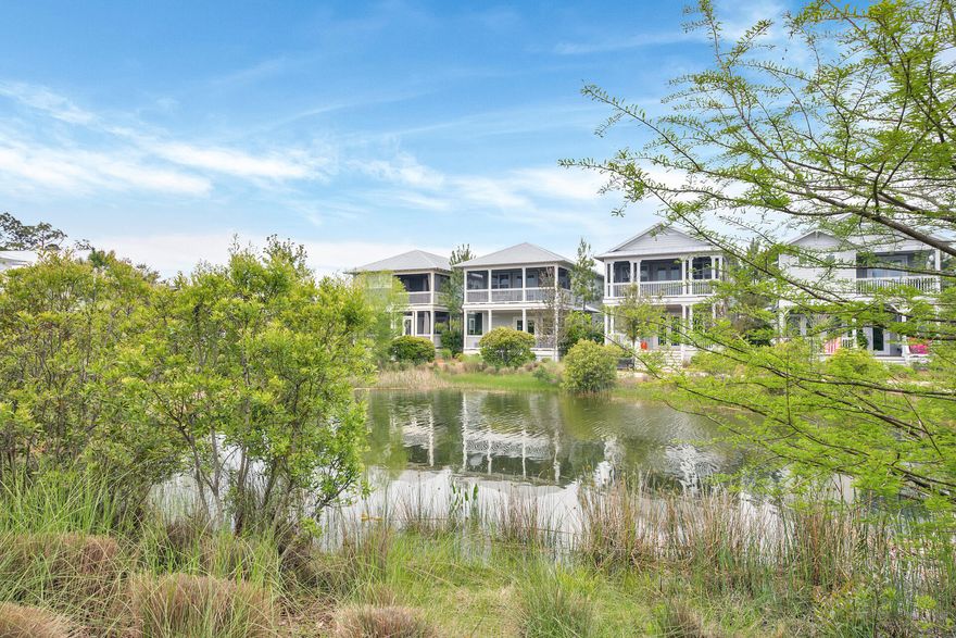 Welcome to 18 Chordgrass Way! Rarely do you find a home located on Sunset Pond in NatureWalk available for sale!  Besides the beautiful pond setting, this home has so much to offer.  Sold fully furnished.
The open floor plan on the 1st floor includes kitchen with stainless steel appliances, granite countertops and island bar, living room and dining room perfect for entertaining. On the first floor you will also find a king bed guest suite, laundry room, and two sitting porches.
On the second floor you'll find the loft which serves as a 2nd inside sitting area for TV viewing or games with access to the large screened third porch overlooking the pond. The second master bedroom and bathroom with double vanity and large walk in closet are also located on the 2nd floor.  You'll also find two more guest bedrooms, one of which is a bunk room perfect for the kids, w shared bath.
Ample storage can be found including a golf cart garage, as well as a generously sized outdoor storage closet. There's also an outdoor shower to rinse off after a day outside!

NatureWalk at Seagrove boasts a lagoon style pool as well as heated lap pool, hot tub, kid's splash pool, a fully stocked pond for catch and release fishing, outdoor grilling area, firepit, and playground. Easily ride down to Publix, Pizza by the Sea, Surfing Deer and more only 2.2 miles to 30A. NatureWalk is nicely tucked away for peace, quiet and privacy but only a short ride down to the hustle and bustle of 30A to enjoy the beach, the restaurants, shopping and sightseeing on 30A.  Call today!