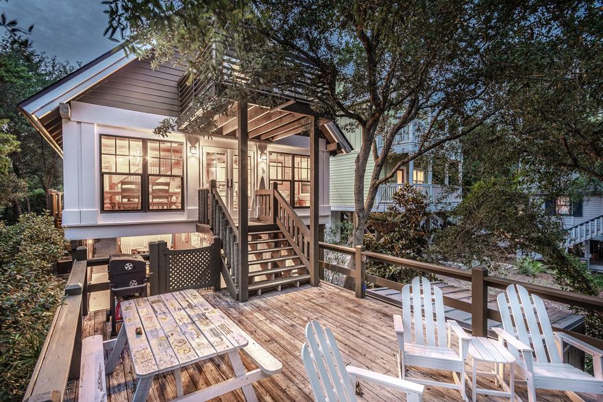 Peaceful waterfront log cabin on Camp Creek Lake with gulf and lake views! This rustic and cozy retreat offers 47 feet of lake frontage on Camp Creek Lake, loaded with multiple decks, a pathway to the private dock and lake access to an uncrowded beach. The front of the home has covered parking for 2 and the driveway gives additional parking. After passing through the covered parking, there is a covered patio which is perfect for entertaining, as well as a guest suite and outdoor shower! The guest suite features a sitting area, twin size bed, mini fridge and a full bathroom. From the ground level, you may choose to walk down to the deck and private dock or you may choose to walk up to the upper deck which leads to the main house. The main living area features an open floor plan with vaulted ceilings, exposed beams, beautiful hardwood flooring, cedar paneled walls French doors leading to an open deck overlooking Camp Creek Lake and boasting gulf views.  The kitchen features granite countertops, a breakfast bar, stainless steel appliances and a gas stove.  The master bedroom is located on the main level with a master bathroom suite.  The second floor contains another full bathroom and 2 additional bedrooms, one of them gracing a private balcony with breathtaking views of the gulf and lake.  Come experience gulf breezes and incredible views while sitting on one of the many decks of this fabulously located home!  Whether you want to fish from the dock or boat over to the gulf, this cozy cabin right off 30-A is waiting for you!