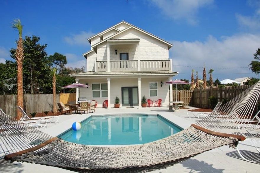 Sitting on an intimate corner lot a few short paces from the beautiful Gulf of Mexico. This Destin Vacation Rental home has 8 bedrooms and 8 full baths. 1 minute walk to beach and home has views of the Gulf of Mexico. Kitchen has custom quartz countertops, custom cabinetry and top grade appliances. Custom lighting and fixtures throughout home as well. Tasteful interior furnishings make this house one of style and class. The Island Pearl has a large private pool(30X15), gas grill. Great investment. Projected income from Beach Luxury was $200,000.