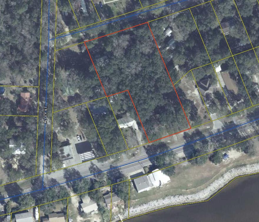 BY APPOINTMENT ONLY - Perfect for a mini-farm, private estate or family compound. Property consists of 1.72 unrestricted acres with old oak trees and unobstructed view of Choctawhatchee Bay. This is one of the last large pieces of property with a water view on the North side of Choctawhatchee Bay. Property consists of:  Brick home built in 1965. Home is clean and in good condition, but needs to be totally updated (likely to include wiring, a new roof and new HVAC system- unlikely will qualify for financing).  On the north side of the property is a manufactured home (double wide) in very good condition with an updated kitchen on community water service. There's also a 2 story barn with 2 chicken coops below and storage above, workshop, plant house, large storage building .....