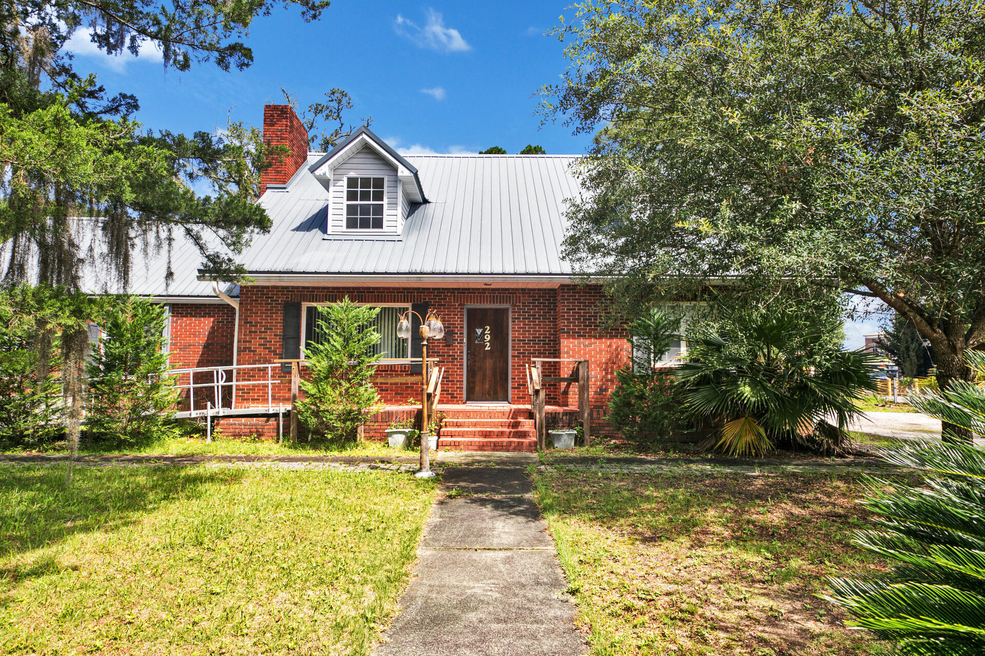 Accepting Back Up Offers during Due diligence period. Great opportunity for your business just 2 blocks from Historic Main St. in downtown Crestview. This once charming residential home was converted to commercial space, but still retains the character and charm of it's original history. You'll be greeted to a large front living/reception area with original hardwood flooring and beautiful fireplace leading to 2 offices formerly bedrooms with closets, a large bathroom, and the former dining room which could be more office space. There's a kitchen that's perfect for employees to take breaks or make lunch. The former 2 car garage was built in for another large space with endless possibilities. There's also a toilet and small sink in the HVAC closet.