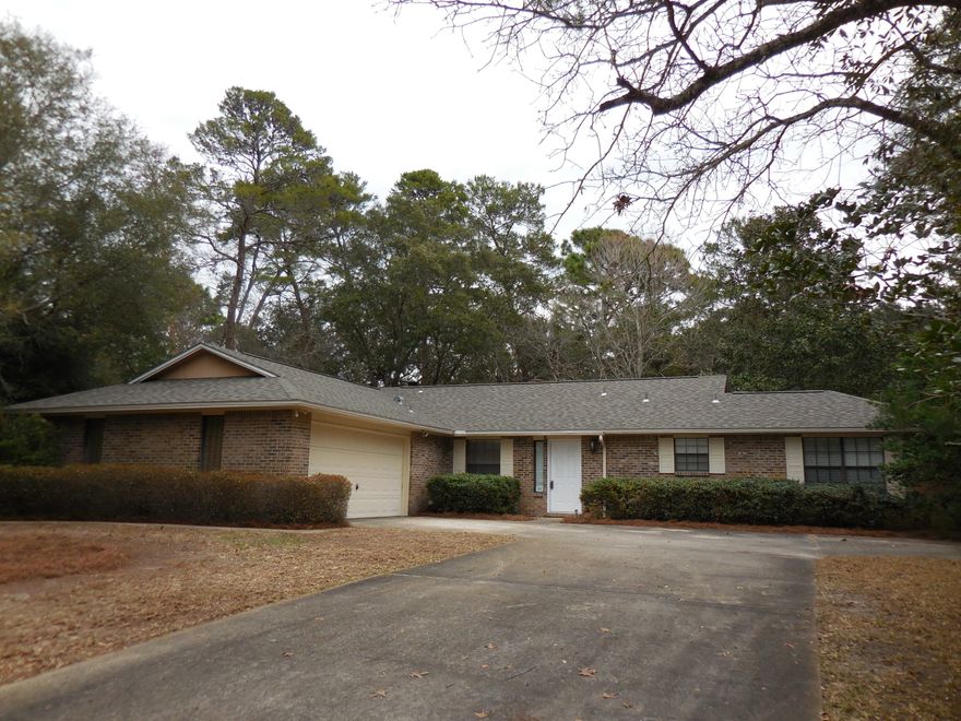 This is a REO. A Fantastic Decorating Opportunity Awaits You in this Well Laid-Out Home! A NEW ROOF, NEW CARPETS, NEW SIDING, NEW PAINT and TERMITE TREATMENT take care of the hard parts. All you have to do is just decorate! The vaulted family room features a glorious fireplace and custom made mantle. The large kitchen has a breakfast bar and bay window breakfast room. Enjoy a formal dining room or use it as an office or living room. The Sunroom off the kitchen could also double as a sitting room or an office...You Decide! The master suite is a dream with its master bath and private patio. You will find a large screened patio off the family room. For storage needs find a unique exterior shed and a large closet and attic in the garage. The lot is large enough for a pool!