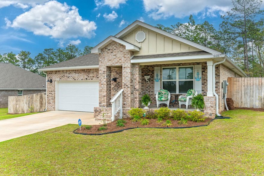 Nestled in the serene landscapes of Heritage Plantation, this all-brick home offers the perfect blend of modern convenience and natural charm.This 4-bedroom, 2-bath Cali floorplan is a beloved layouts--featuring an open concept design that's ideal for entertaining or relaxed everyday living. The beautiful kitchen has a large island bar and sleek SS appliances. The spacious living area flows seamlessly onto a covered back patio with gazebo and fenced backyard that is great for outdoor gatherings! You'll also appreciate the spacious secondary bedrooms and modern perks like the Smart Home 'Connect' System, keyless entry, video camera doorbell, and fabric hurricane protection for peace of mind. This is more than just a home. It's a retreat in one of the area's most premier neighborhoods!