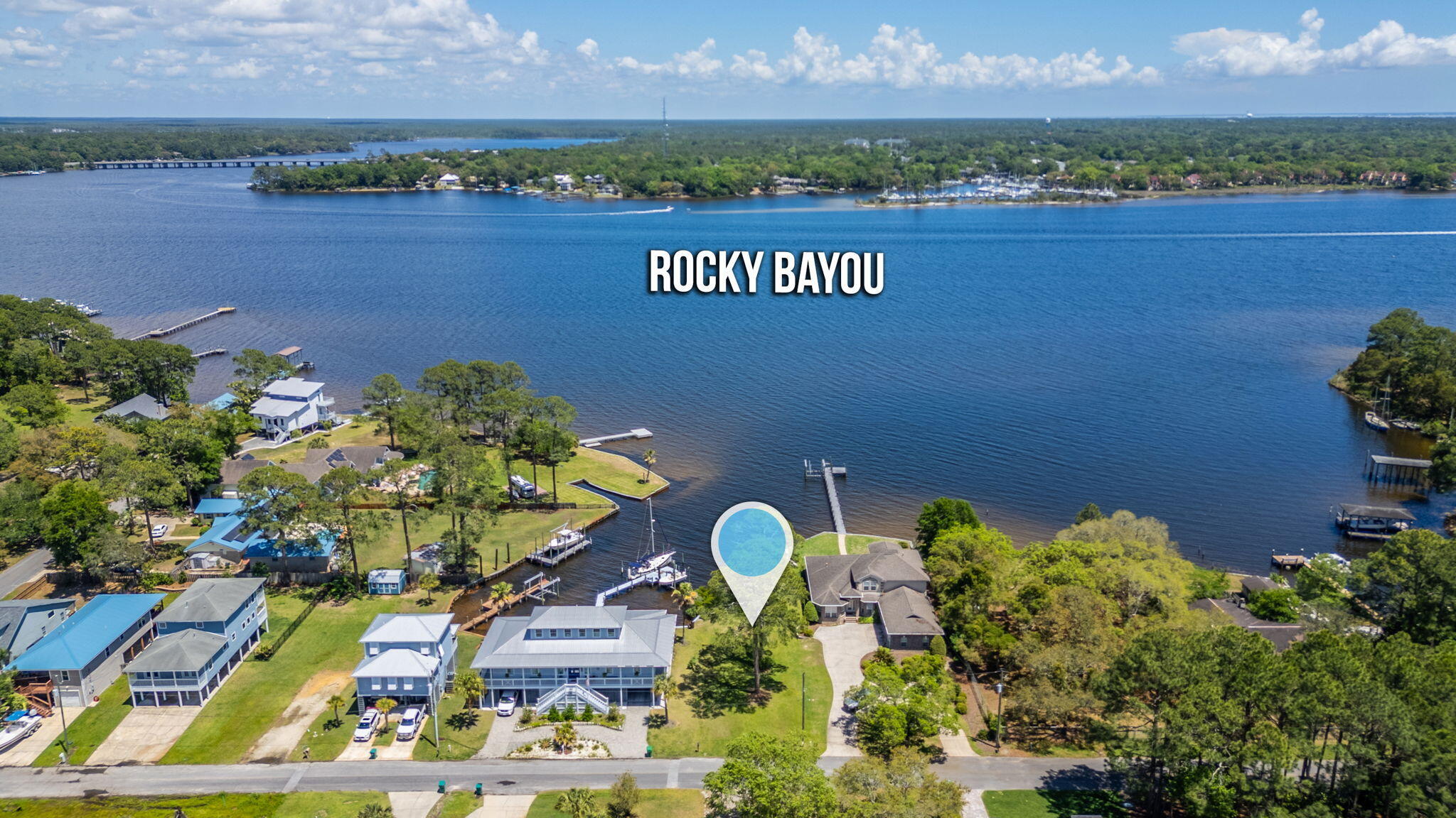 Lovely waterfront lot on beautiful Rocky Bayou with views and access to the Choctawhatchee Bay. Located across from the Bluewater Bay Marina, this lot is 50 feet wide. County office says 25' setback from water is allowable. Lot is cleared, level, and ready for your dream home or vacation get -away. There are not many waterfront lots left in Niceville - this is your chance! Dock estimate and survey available in the agent documents. Seller has approval/exemptions from DEP and Army Corp of Engineering for dock.
