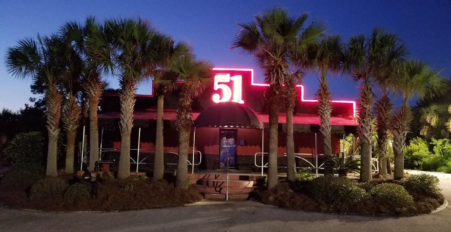4,000+ square foot cinder block building, with stucco exterior and red metal roof. 2.11 acres of land (2 lots), which includes 200 feet of land bordering U.S. Hwy 98. Separate paved ingress/egress. Located 4 miles west of Hurlburt AFB on north side of heavily traveled U.S. Hwy 98.Elevation of property very high, allowing for great view of Santa Rosa Sound without threat of flooding. Property has broad use potential. Great for restaurant and/or Lounge site. Property to be sold under the stipulation that it can no longer be used as an entertainment establishment.