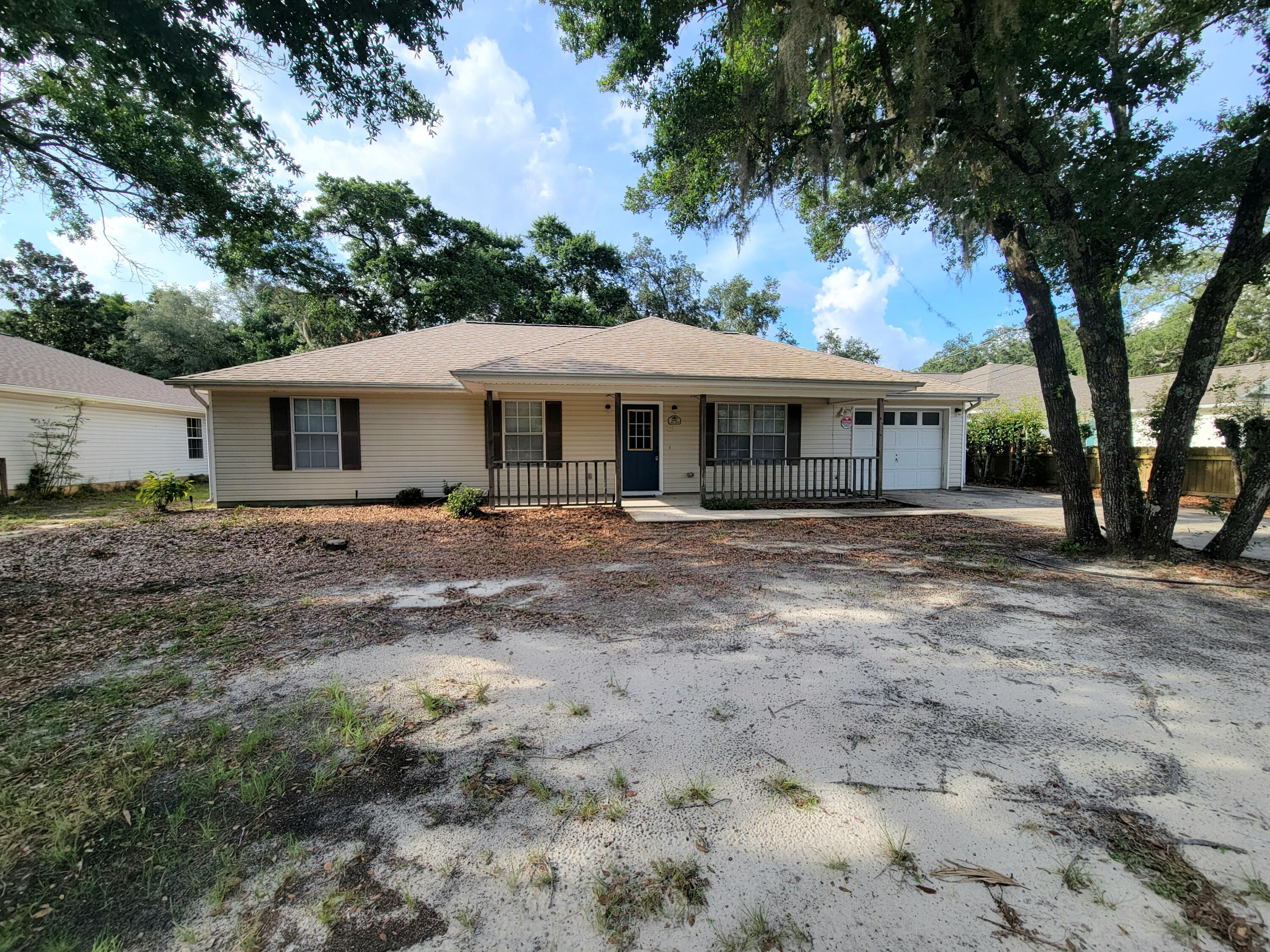 Near Tom King Bayou, this property offers a spacious 3 bedroom 2 baths freshly painted interior with a beautiful kitchen with four new appliances - refrigerator, stove, dishwasher and microwave. Home showcases new laminated floor covering in all 3 bedrooms and a bath, almost new laminated floor covering in the living room. Kitchen and one bath with ceramic tile. Nice shady .26 ac. lot with a treehouse in the fully fenced in back yard. Lots of extra room in this 1418 heated sf home with a 1 car attached garage. Covered front and screened in back patio, perfect for outdoor activities. New roof in 2020. Easy to show.