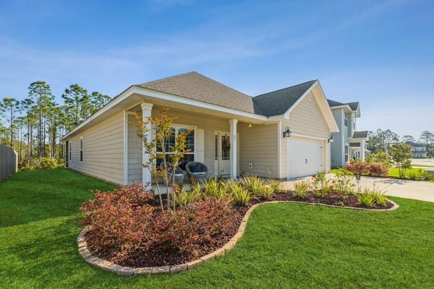 open house 4/25 11 -1 Eagle Bay Landing is in the heart of Santa Rosa Beach minutes from the Gulf of Mexico. Craftsman style home built in 2018 with a 2 car garage features open floor plan, large split guest bedrooms, spacious kitchen boasting island with storage, light hand painted cabinets and granite countertops in the kitchen and baths.  Home is situated on private street backing up to conservation for the ultimate serenity. Home features a separate office or reading room, luxury vinyl plank throughout all rooms, carpet in bedrooms.  The master bedroom has double trey ceilings with crown moulding, a large master bath with tiled shower, separate tub, double sinks and a large walk-in closet.  The living area has double trey ceilings with crown moulding and looks out over