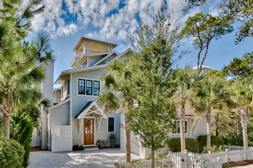 With a coveted WaterSound Beach address, this six bedroom single family home is located south of Scenic 30A and within walking distance to the white sandy beach and gorgeous emerald Gulf. Built in 2017, this exceptional home has been lovingly maintained and has never been on the rental market. It features high quality materials and bespoke features including brick and pecky cypress accent walls, reclaimed wood beams, lofty 10-foot high ceilings and an eye-catching tabby fireplace in the living room. Spread over three floors, there is elevator access to all levels. Head up to the tower at sunset and raise a toast to the mesmerizing Gulf and dune views. The kitchen has lighted display cabinets and a practical island dining area. Run your hand over the beautiful carrera marble countertops and feel the cool silky-smooth finish. A handy wine cooler, dual sinks and Sub-Zero and Wolf appliances make cooking and entertaining a real pleasure. From the inviting sitting room, head outside to the outdoor area with cozy gas fireplace and outdoor grill for entertaining and memory-making. The private heated saltwater pool stands ready for refreshing dips and is surrounded by beautiful hardwood Ipe decking. There's a useful detached garage for stowing bikes and beach toys nearby. There's so much more to enjoy when you live at WaterSound Beach. Hop on your bicycle or golf cart and explore seven miles of boardwalks and walking paths or head to the fitness center for an air-conditioned workout. Community parks provide play areas for children and dogs. In addition, there's a full mile of pristine white sandy beach waiting for you, shared with turtles, sea birds and the occasional dolphin.