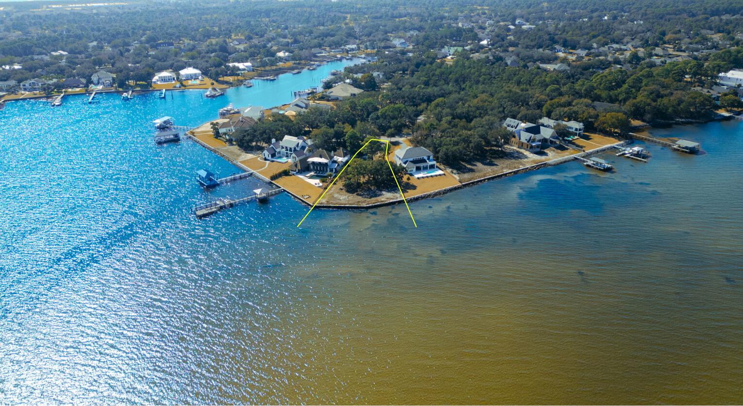 The Estates at Indian Pointe is Destin's premier gated waterfront community with a small enclave of only 13 homesites. Lot 6 is perfectly positioned on the point with East and West views over the bay and the most water frontage of any lot in the community with 164 feet. These estate sized lots were designed with 5000 sq. feet or more of living space in mind. The neighborhood is rental restricted with a one year minimum lease term. A few privileged owners will enjoy the serene surroundings of this quaint neighborhood while being just minutes from the thriving Destin harbor, restaurants and white sandy beaches of the Emerald Coast.