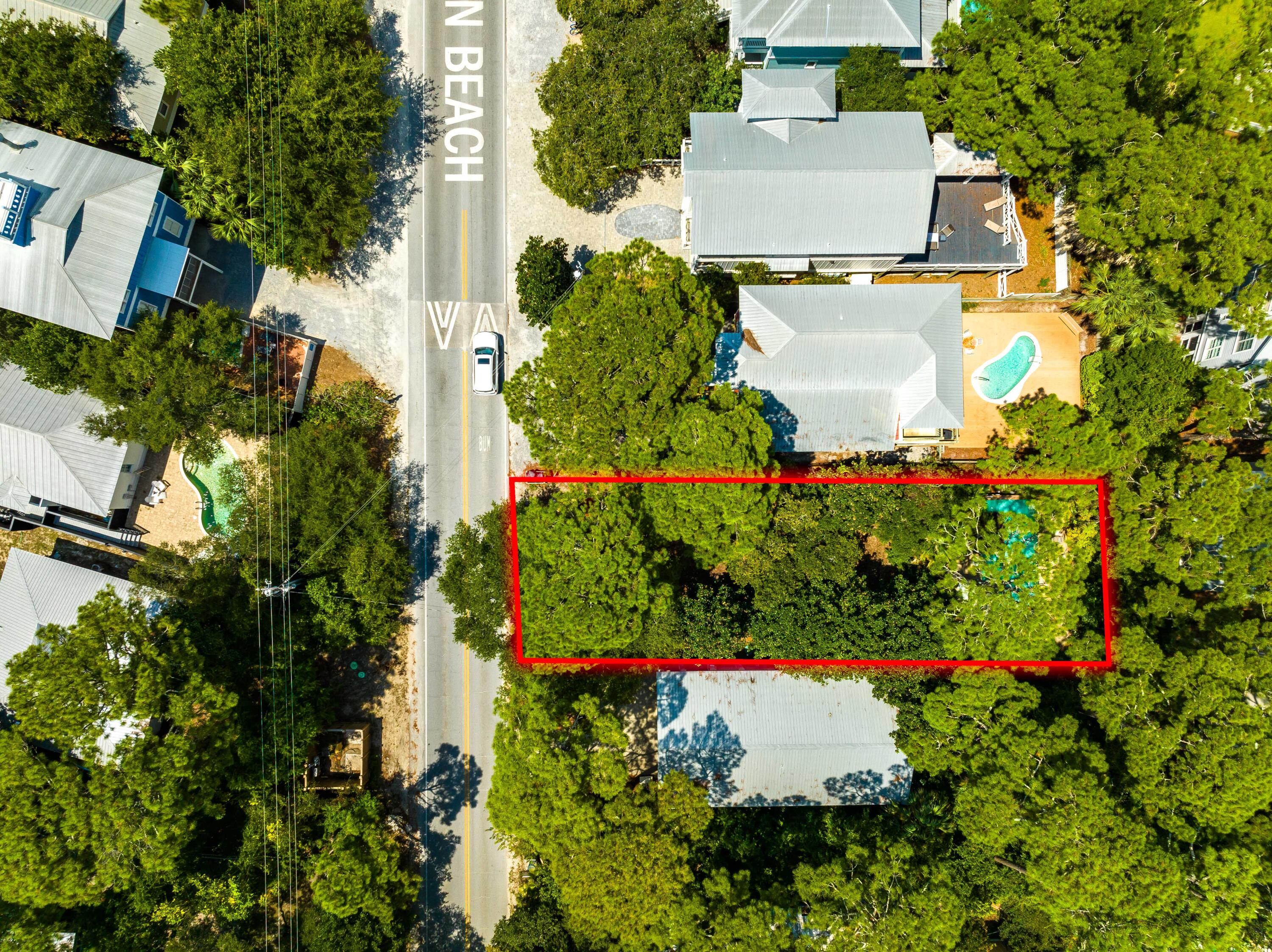 Located South of 30A, this offering is a great opportunity to build your dream home on one of the last remaining vacant lots in the historic, 'Old Florida' community of Grayton Beach. Covered with native magnolias, palmettos, and sand live oaks, this natural masterpiece is an unpainted canvas awaiting your plan for a beach dream home. Grayton Beach has been consistently ranked in the top 10 beaches in the world! This homesite is conveniently positioned within walking distance of Scenic 30A's most iconic restaurant, The Red Bar, the sugar white sand and emerald Gulf water, AND is also surrounded by Grayton State Park and Coastal Dune Lake - Western Lake. Enjoy true Florida living along stunning beaches, bike riding, fishing, boating, or boarding on Western Lake plus a convenient location n