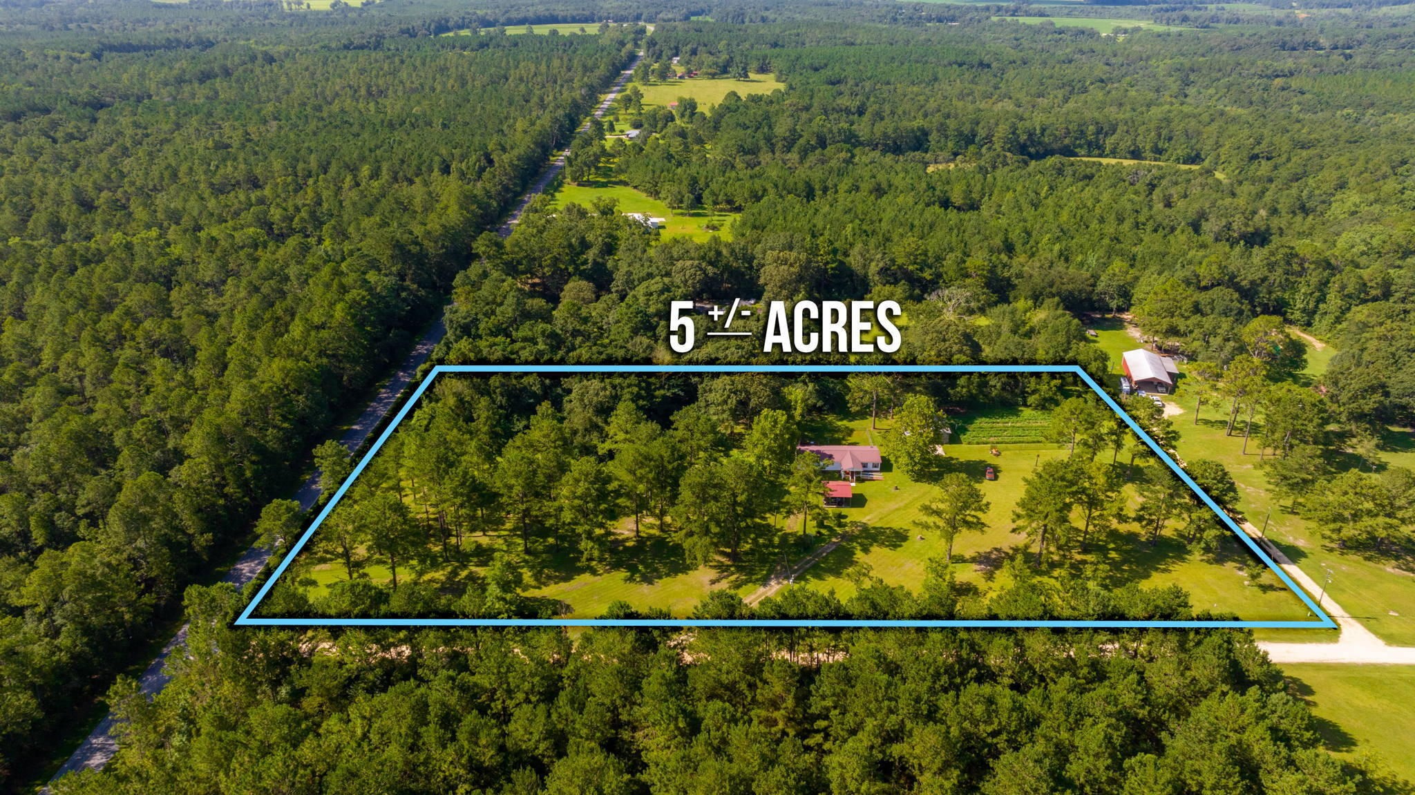 COUNTRY LIVING WITH CITY CONVENIENCE! Are you seeking rural atmosphere living with city convenience? Then this 1,904 sf home located on a gorgeous five acre parcel within minutes to Laurel Hill shopping, 10 minutes to Florala, AL and 20 minutes to Crestview will have definite appeal. The meticulously maintained grounds is your own oasis offering peace, quiet and privacy. An established garden area is already in place, along with an adorable chicken coop! The meat processing out building is equipped with a floor catch basin, ice machine and window A/C (all conveyed as-is) and sure to be a welcomed feature to the hunter in the family. The 24x30 Workshop/Storage Building adds additional space for wood working, boat & ATV storage. The well cared for manufactured home offers a metal roof, vinyl siding and all brick skirting. A 22x20 detached steel carport is conveniently located to access the 14x14 covered front porch. The laundry room entrance door is equipped with a doggie door that leads out to the 20x16 rear deck and chain link fenced back yard area. Property is located directly off paved Ludlam Road.