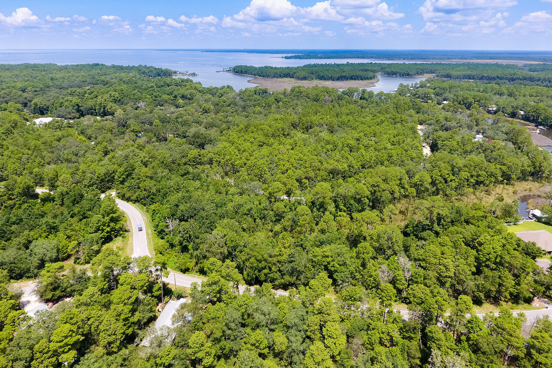 Build the home of your dreams on two adjoining prime lots in sought after Eden Estates. Located in the heart of Santa Rosa Beach yet offering lots of privacy, the property is near beautiful Eden State Park and Gardens and public boat launch. This warm and nostalgic minded community, filled with mature landscaping, wonderful cottages, peaceful winding roads and top rated schools, is just moments from white sandy beaches, provides the best of Florida living. With popular dining, shopping and a host of activities just minutes away, whether you are planning a vacation property or year round home, discover why Eden Estates is the ideal place to make new memories.