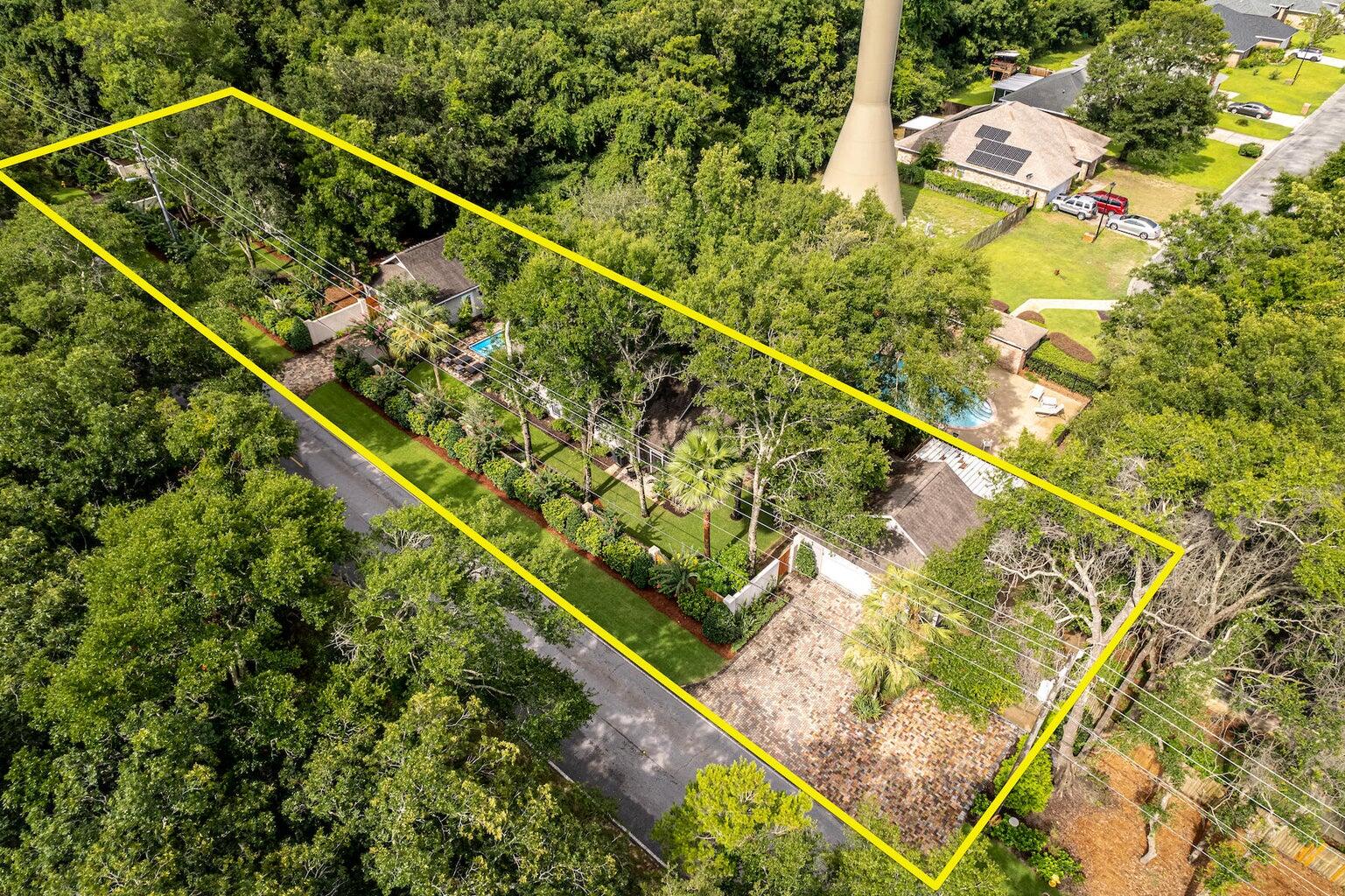 MOTIVATED SELLER!!!*Buyers financing fell through at no fault to the sellers. Discover the Hidden Gem: A Unique Family CompoundNestled within a serene oasis of lush greenery, this extraordinary property presents a rare opportunity for those seeking an expansive and private family compound. This unique offering includes five separate structures, seamlessly blending versatility, comfort, and privacy into a layout perfect for family life, guests, or creative pursuits. 
Key Features:
- **7 Bedrooms & 5.5 Bathrooms**: Ample space for a large family, guests, or workspaces, ensuring everyone has their private retreat.
- **Extensive Parking**: Accommodates over 10 vehicles with three garages and an oversized parking pad, suitable for a boat or large recreational vehicle, providing ample space for all your toys and tools.
- **Central Pool**: At the heart of the compound lies a communal pool, accessible by all dwellings, perfect for relaxation or family gatherings.
- **Recent Upgrades**: The entire property has been rejuvenated with a comprehensive facelift. Recent enhancements include a newly installed fence, all-new fixtures, and fresh paint throughout.
- **Ultimate Privacy**: Completely enveloped by vibrant greenery, this estate offers unparalleled privacy, making it a sanctuary away from the bustling world.

This exceptional compound is more than a home; it's a lifestyle offering. The unique distribution of spaces across five structures provides both togetherness and privacy, allowing for a perfect balance of family interaction and individual solitude. The strategic placement of the central pool fosters a sense of community and leisure, acting as the beating heart of this remarkable compound. Security and privacy are paramount, with recent updates to fencing and the property's natural green barrier providing a secluded haven for you and your loved ones. 

Don't miss this unparalleled opportunity to own a versatile and sprawling compound that promises a blend of luxury, privacy, and functionality. Contact us today for a private showing of this hard-to-find property, and take the first step towards making this hidden gem your family's new sanctuary.

All information deemed accurate, but buyer must verify all information, including but not limited to dimensions, square footage, zoning, land use, and Walton County use restrictions.