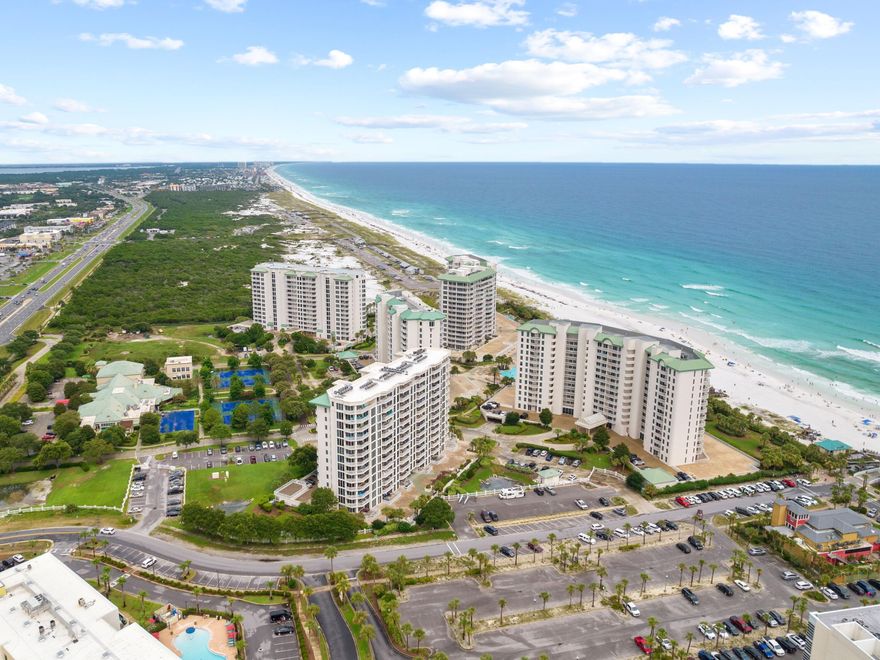 Take in amazing sunset views from this west-facing condo in the St. Lucia building at gated Silver Shells Beach Resort in Destin. Just steps away from the sugar-white sands of the Emerald Coast, this unit boasts a private balcony with beach views, a full laundry room a remarkable owner's suite with adjoining bath complete with oversized bathtub. High-end tile flooring and granite throughout is completed by coastal decor. The kitchen has stainless steel appliances and bar seating, adjacent to a dedicated dining space. Silver Shells offers numerous amenities including a seasonally-heated, 7,500-sq.-ft. lagoon pool, whirlpools bordered by arbor-covered grilling stations, a playground and beach access.
