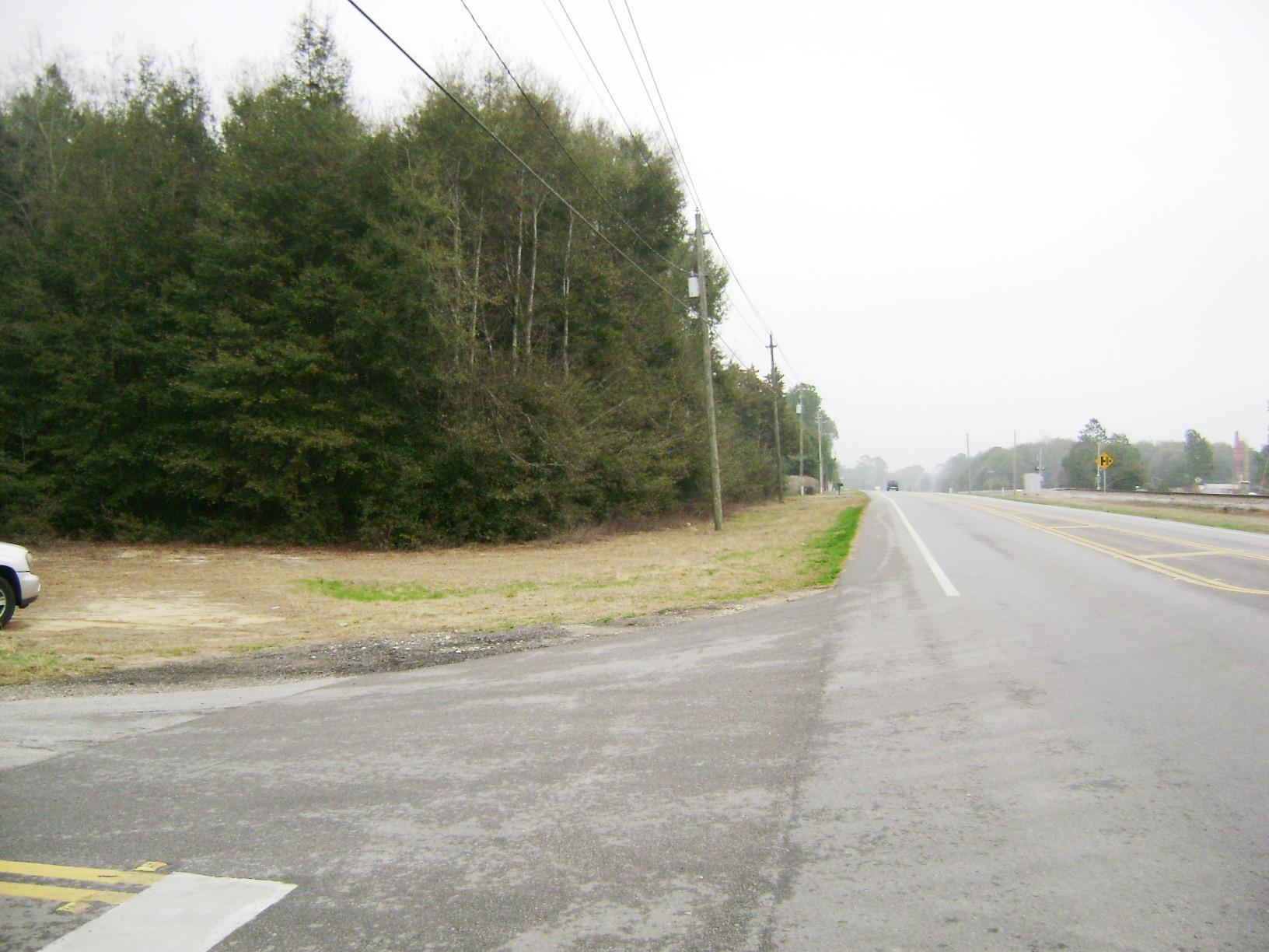 PRICE REDUCED!! Bank Owned. 9.8 acres fronting Hwy 90 and N Norwood Rd. Property is wooded. Personal residential use is allowed although Walton County Planning Department states the Land Use is Rural Village which allows some neighborhood commercial use at an intersection. Density is 2 units per acre. Civic and public uses are also allowed. Any use would need to be approved by Walton County. Argyle Water system is available to the parcel as well as natural gas from the City of DeFuniak Springs. Many possibilities for this property!!